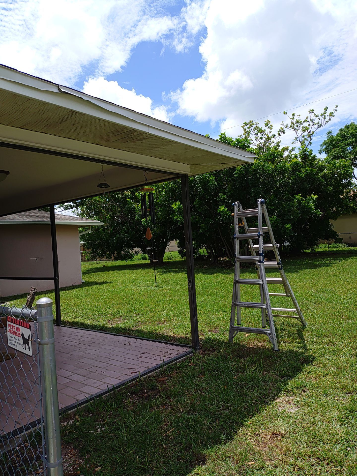 Replace gutter using White Down Spouts in Cape Coral FL by Gutter Professors