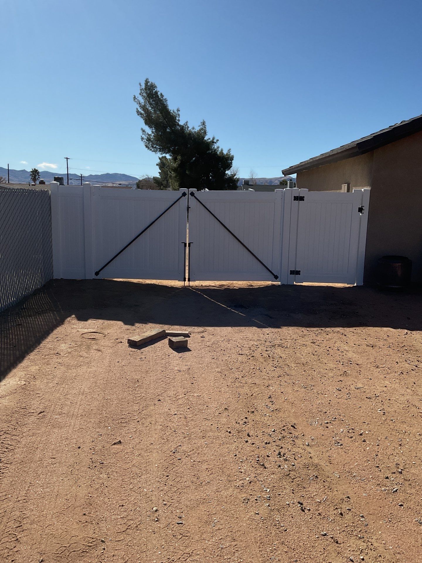 Gate installation using Vinyl by Fence Guys Inc. 