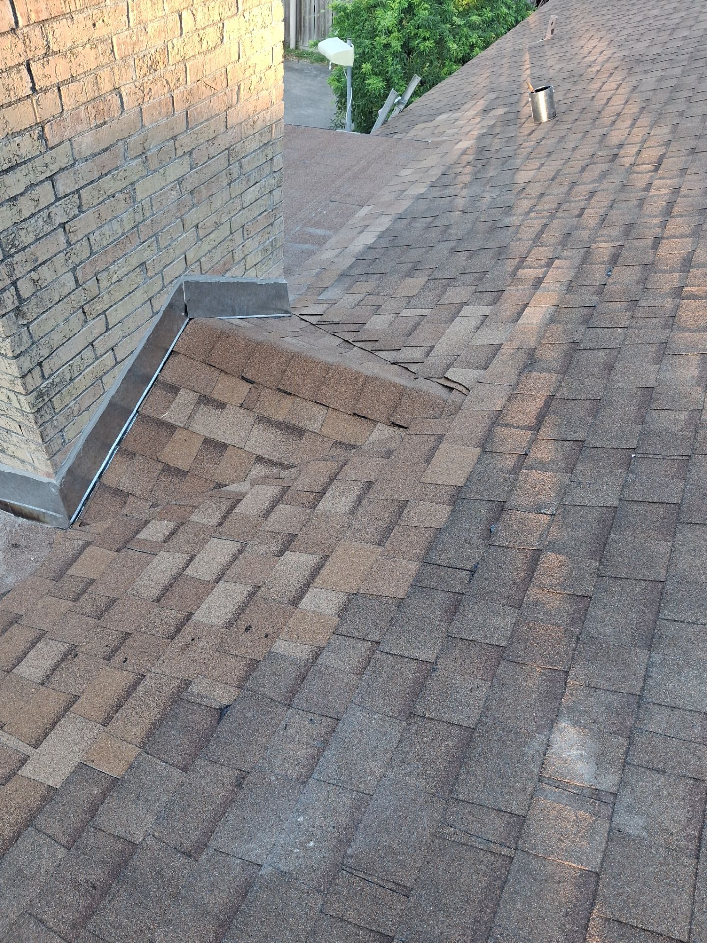 Chimneys need a Cricket.  by Bayfront Roofing and Construction