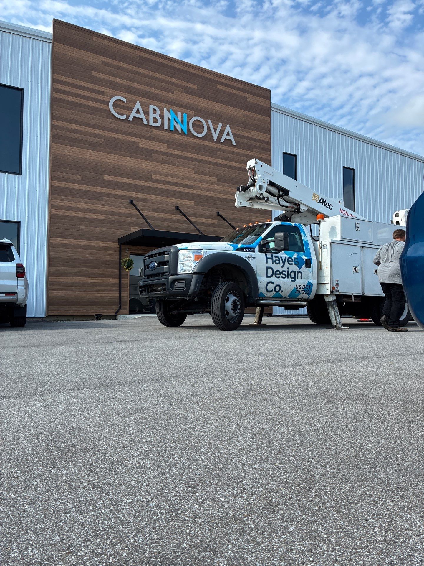 Custom Cabnova Metal Lettering and Wood-Look Panel Installation in Bremen by Hayes Design co