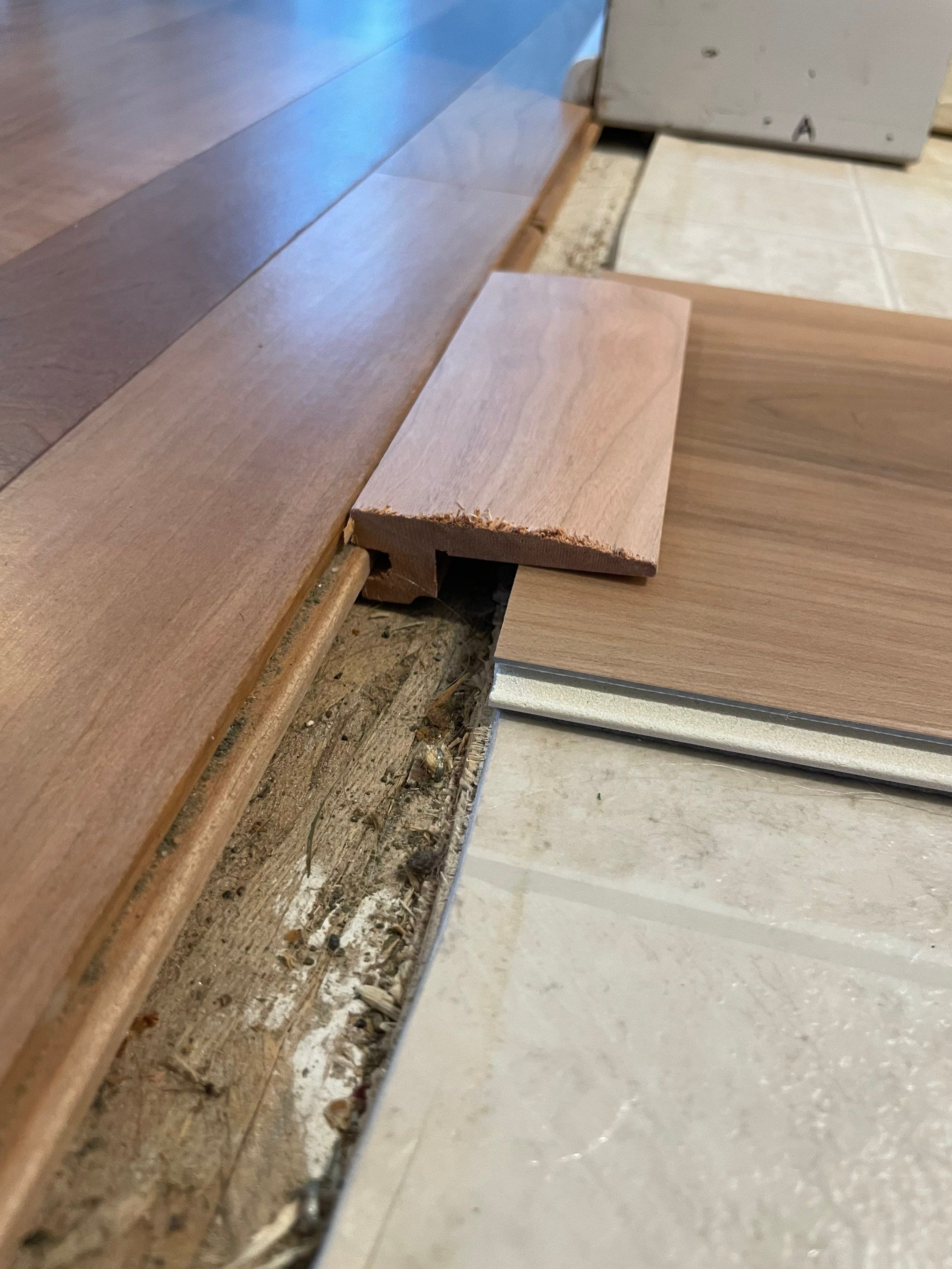 LVP Install to high traffic entry, custom threshold! by RTBaldwin Hardwood Floors