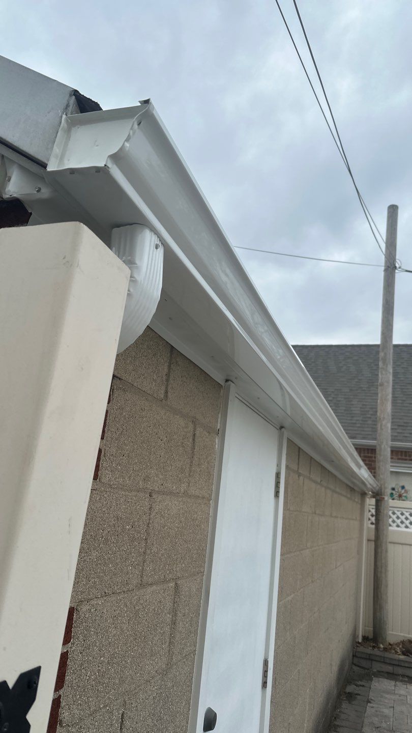 Queens Garage Fascia Rebuild + New 5" Seamless Gutter by Above All Gutters