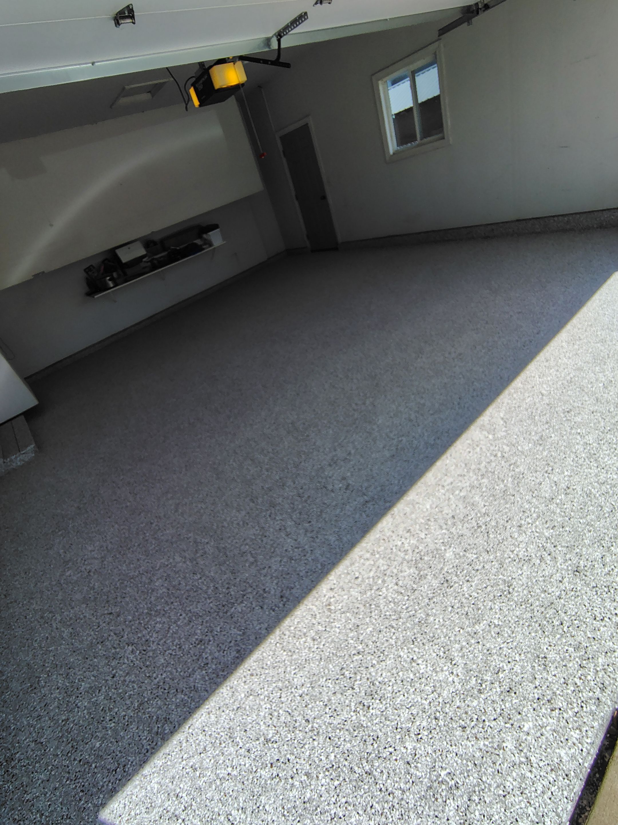 Decorative Chip Epoxy Garage Floor Coating in Sioux Falls by Select Painting, Coatings & Garage Cabinets
