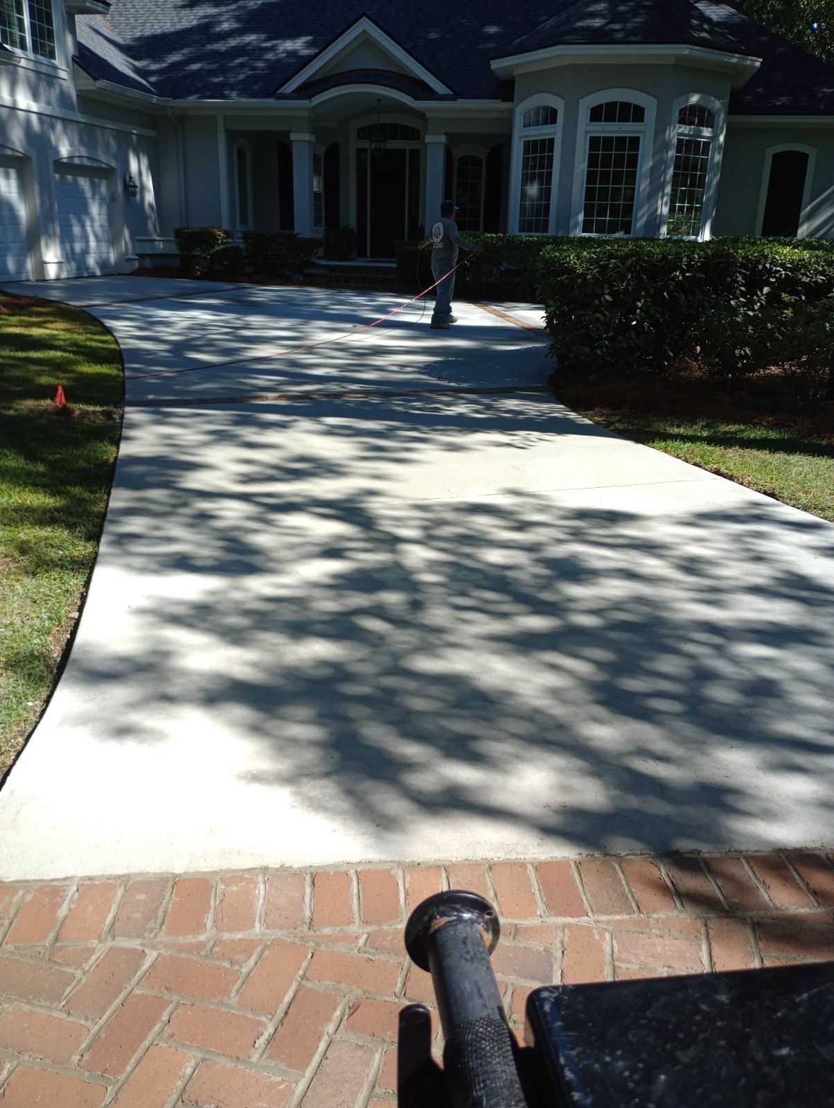 Hilton Head Island Concrete Driveway Replacement with Herringbone Brick Inlays by Lowcountry Scapes, LLC