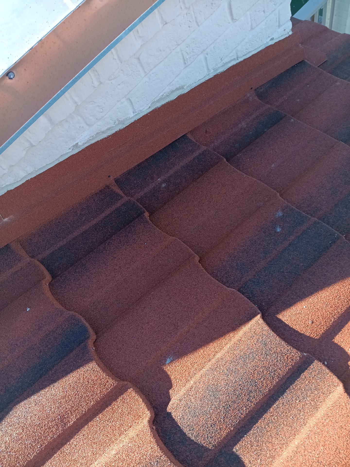 Off with the Tile and on with the TILCOR stone coated metal.  by Bayfront Roofing and Construction