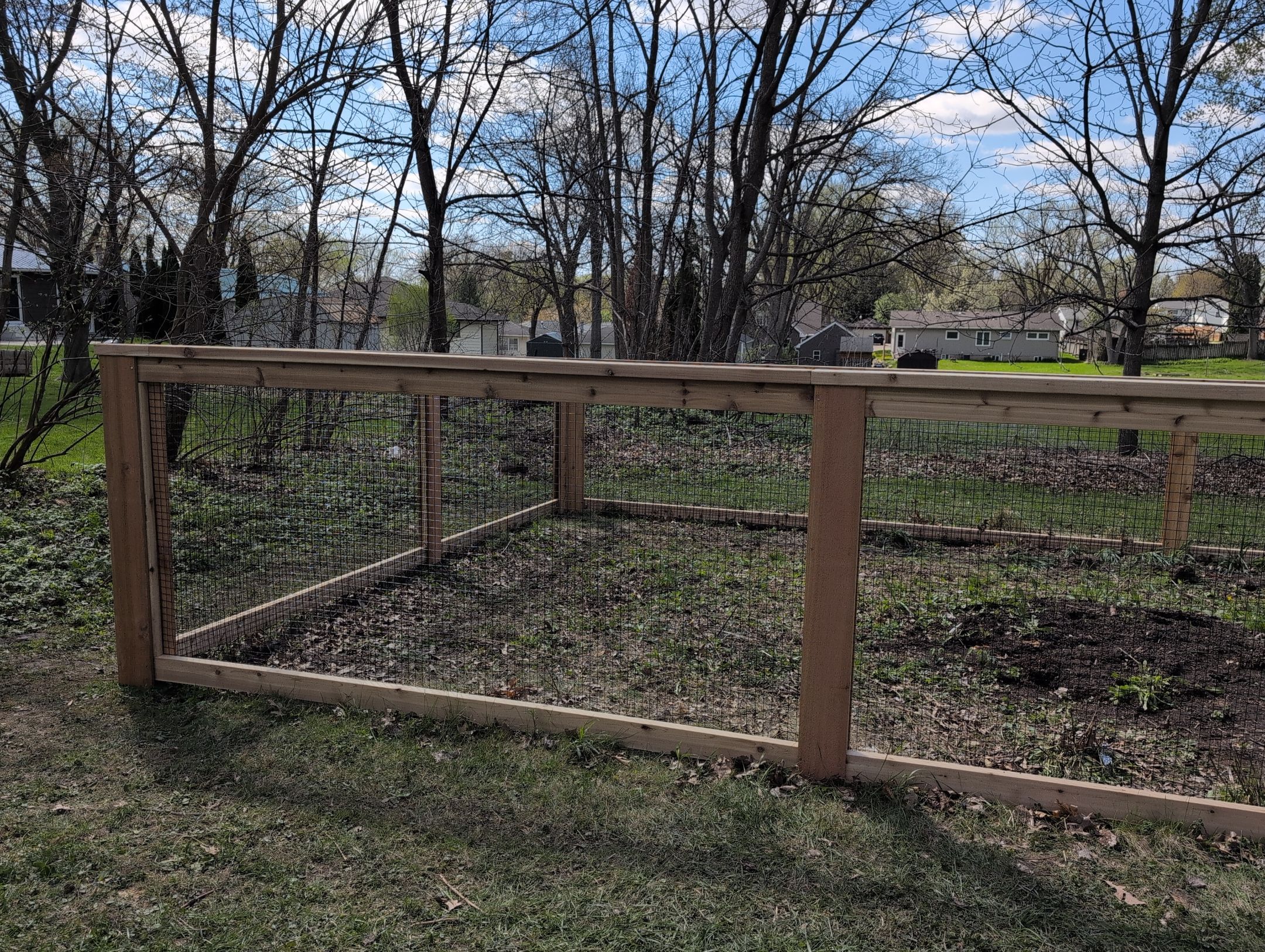 Custom Cedar Wood Garden Fence Installation in Cedar Falls by Perfect Picket Fence and Stain