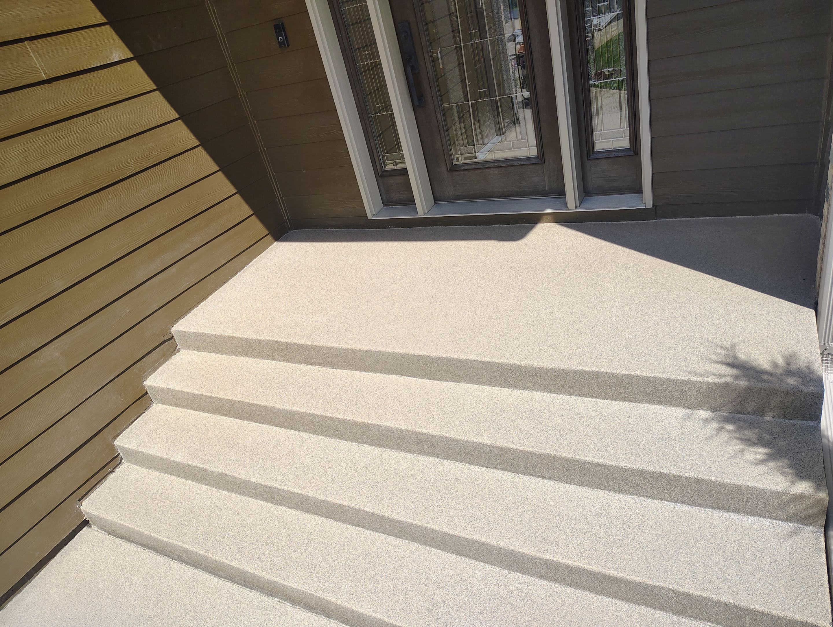 Textured Concrete Coating and Entryway Restoration in Madison by Select Painting, Coatings & Garage Cabinets