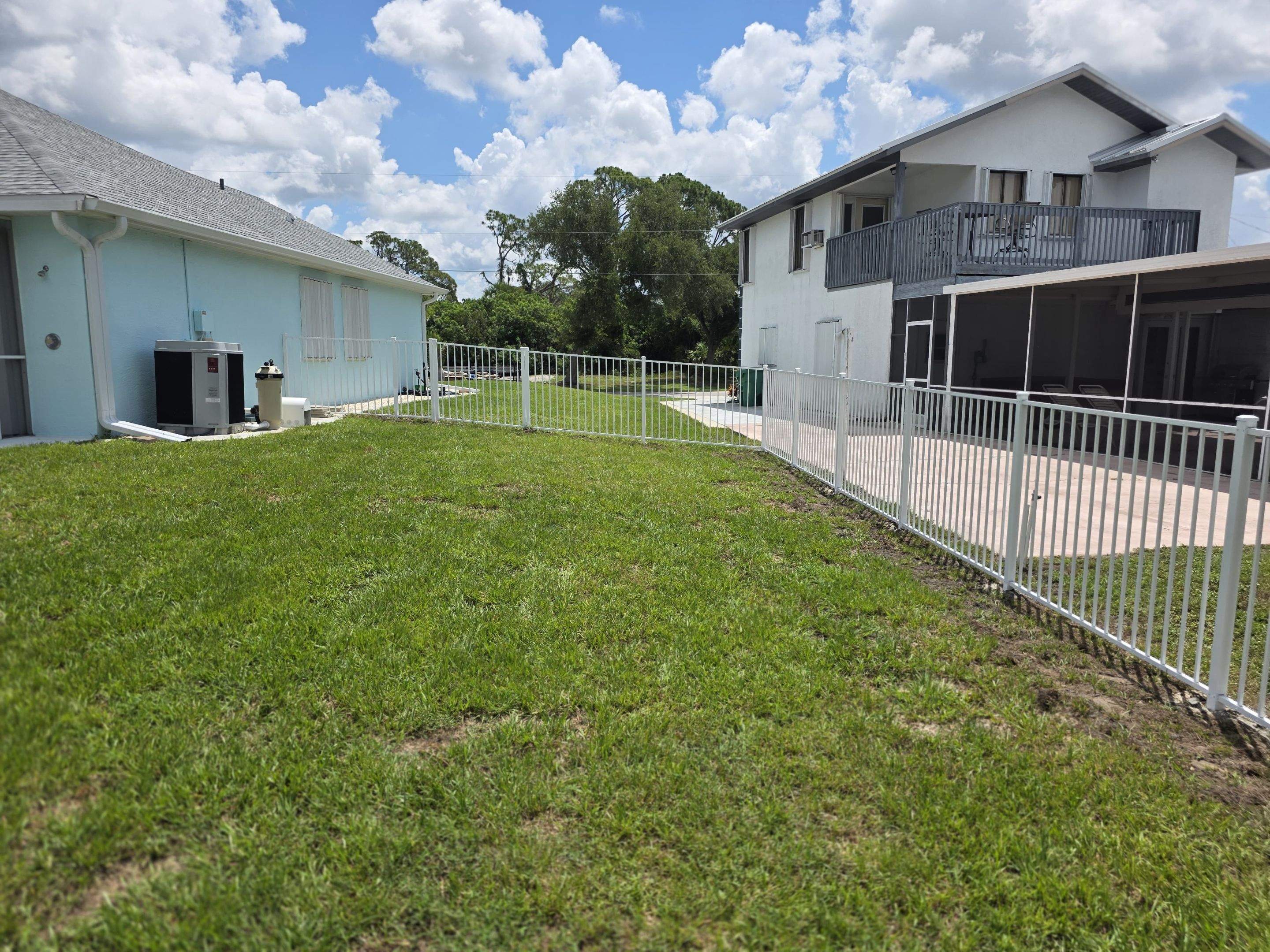 White Aluminum Picket Fence Installation for Port Charlotte Waterfront Home by True Fence LLC