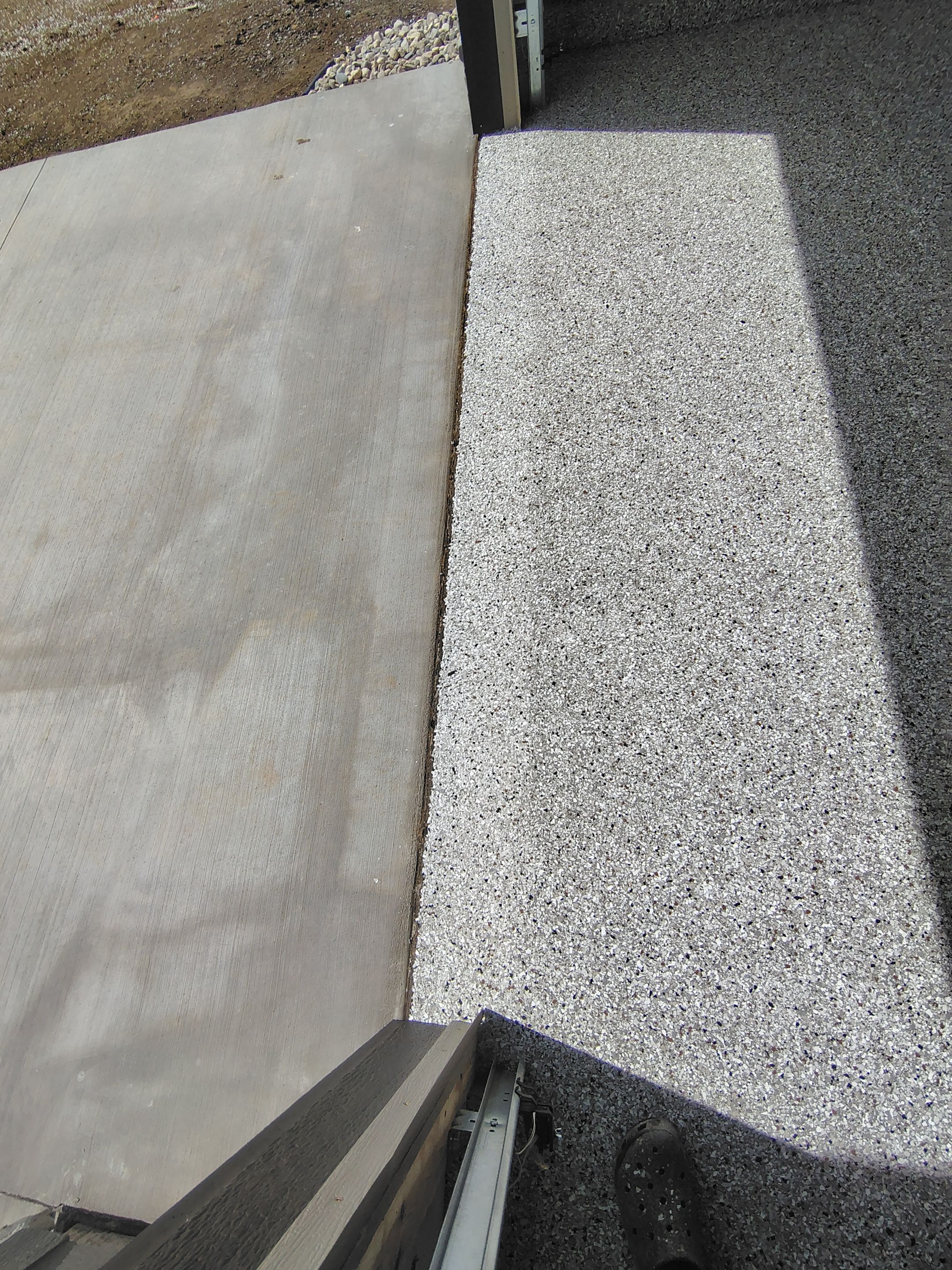Speckled Epoxy Garage Floor Coating Installation in Sioux Falls by Select Painting, Coatings & Garage Cabinets