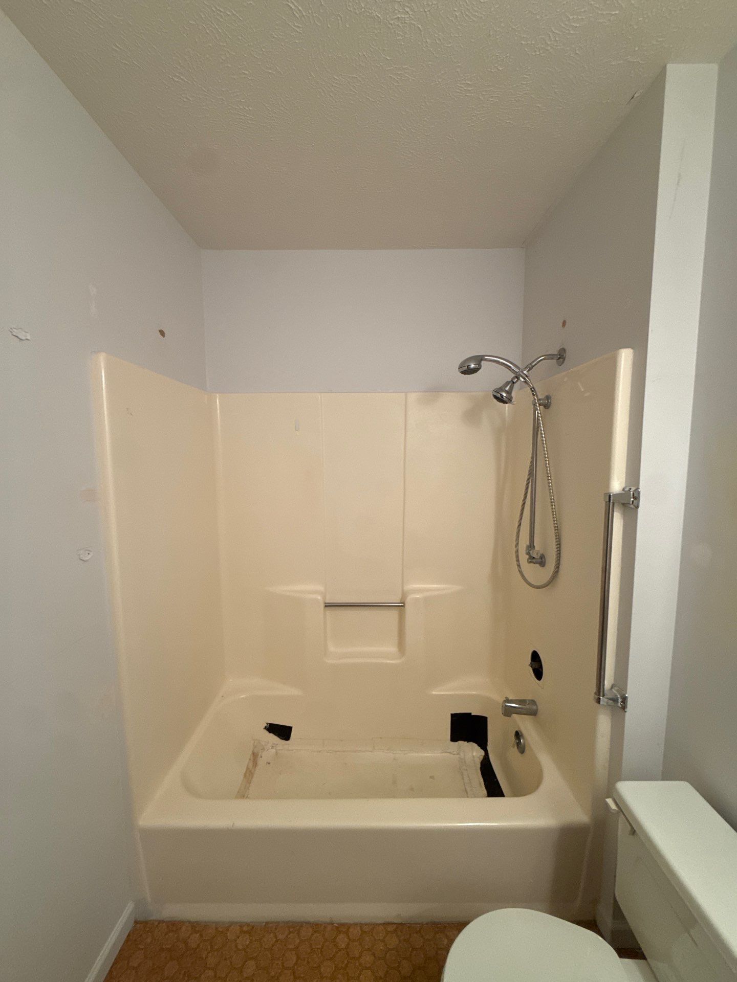 White Subway Tile Bath Remodel With Accessibility Upgrades In Traverse City by Rainbow Seamless Systems