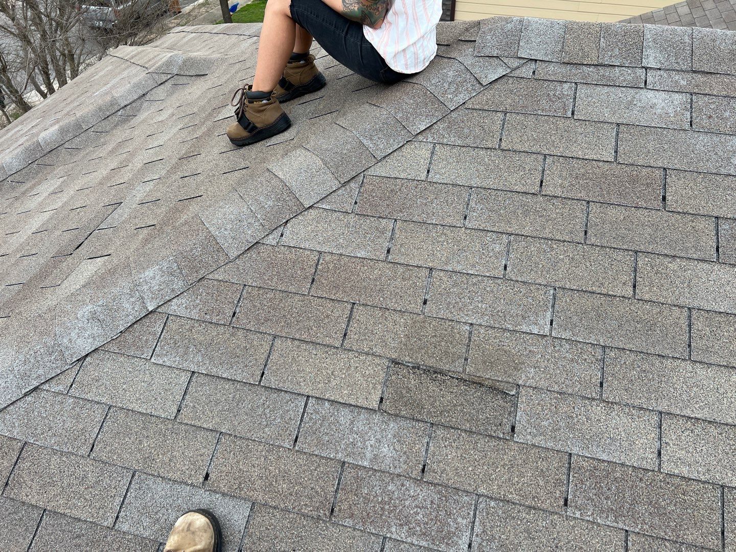 Wind damaged roof replacement by Oakwood Roofing and Construction, LLC