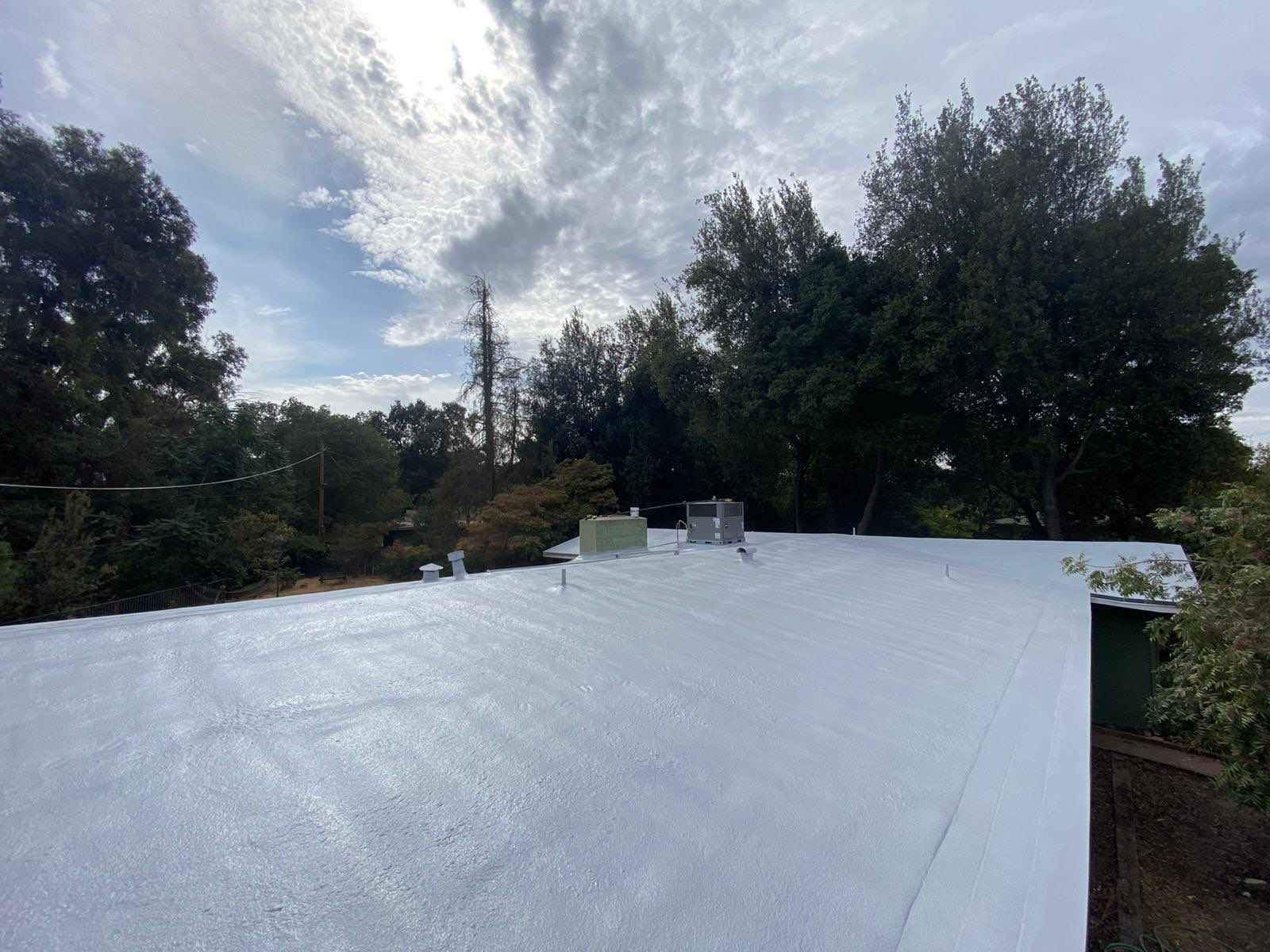 New spray insulation roof over tar and gravel with coatings by Straight Edge Roofing Inc