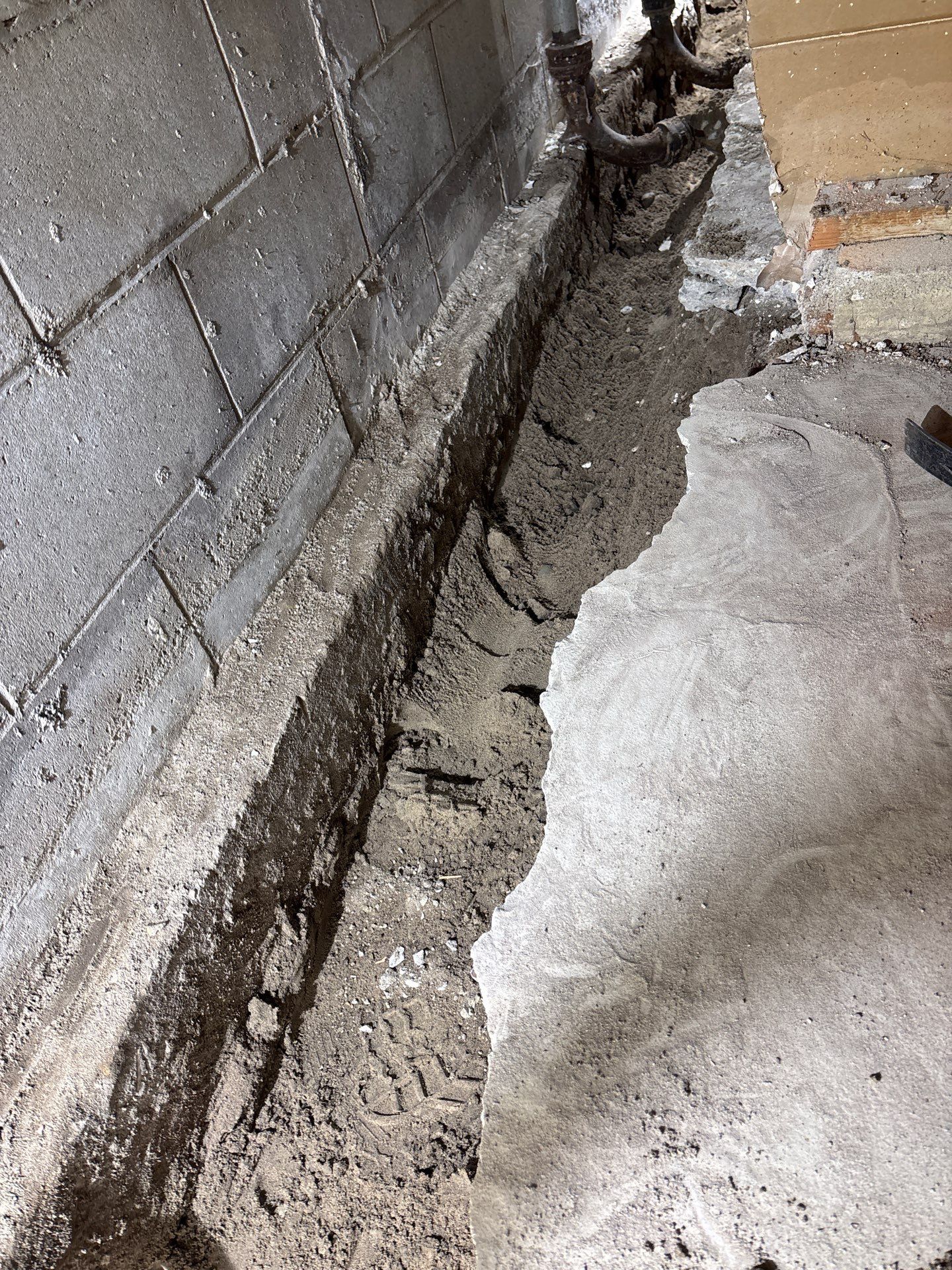 Interior Drain Tile & Buried Discharge in South Minneapolis by Waterproofing Northeast