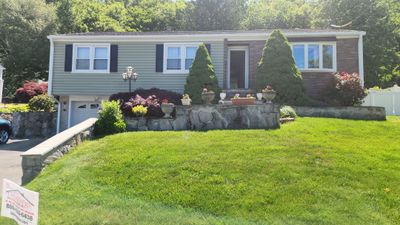 Siding Makeover with Cert. Monogram D/5 Dutchlap, Cypress & Tando Stone Sedona Bluff