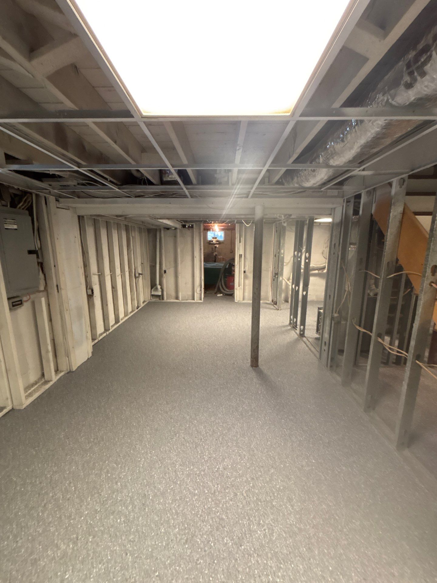 Basement Concrete Floor Coating with Penntek Flake System by Spectrum Painting, LLC