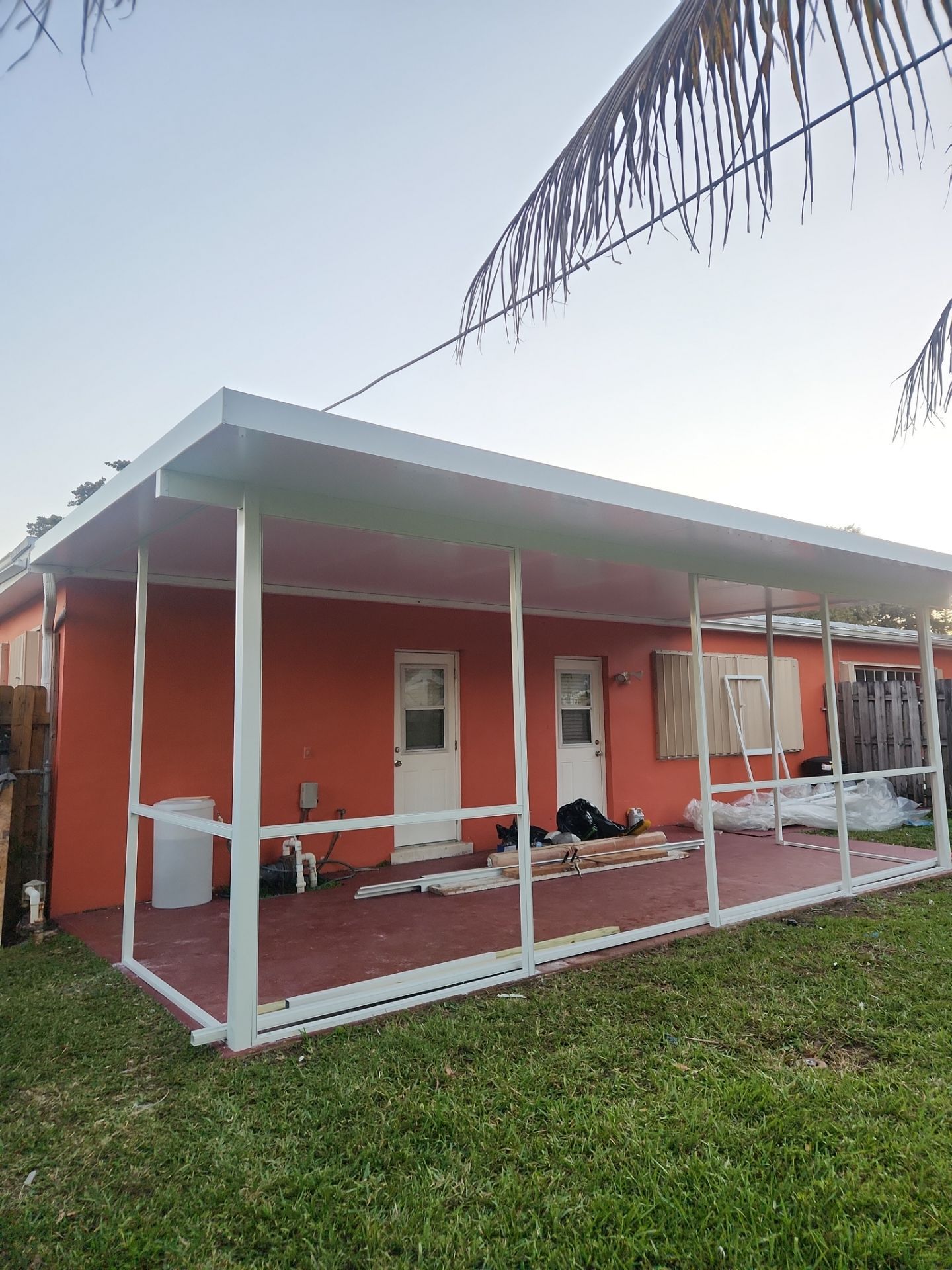 Insulated Screen Enclosure and Wood Tile Deck Installation in Plantation by Aastro Roofing