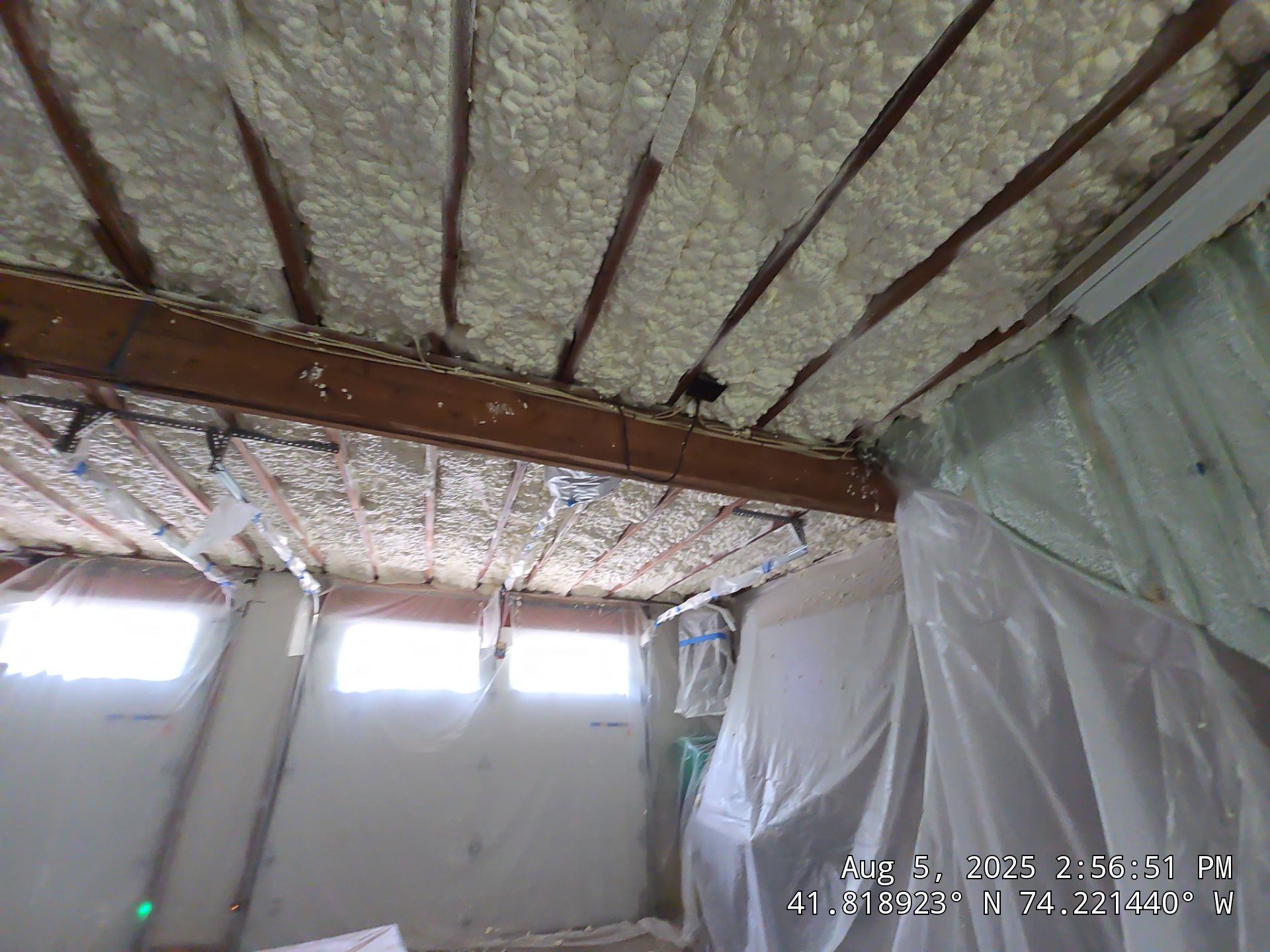 Master bedroom Exterior Walls using open cell spray foam by NYS Foam & Energy