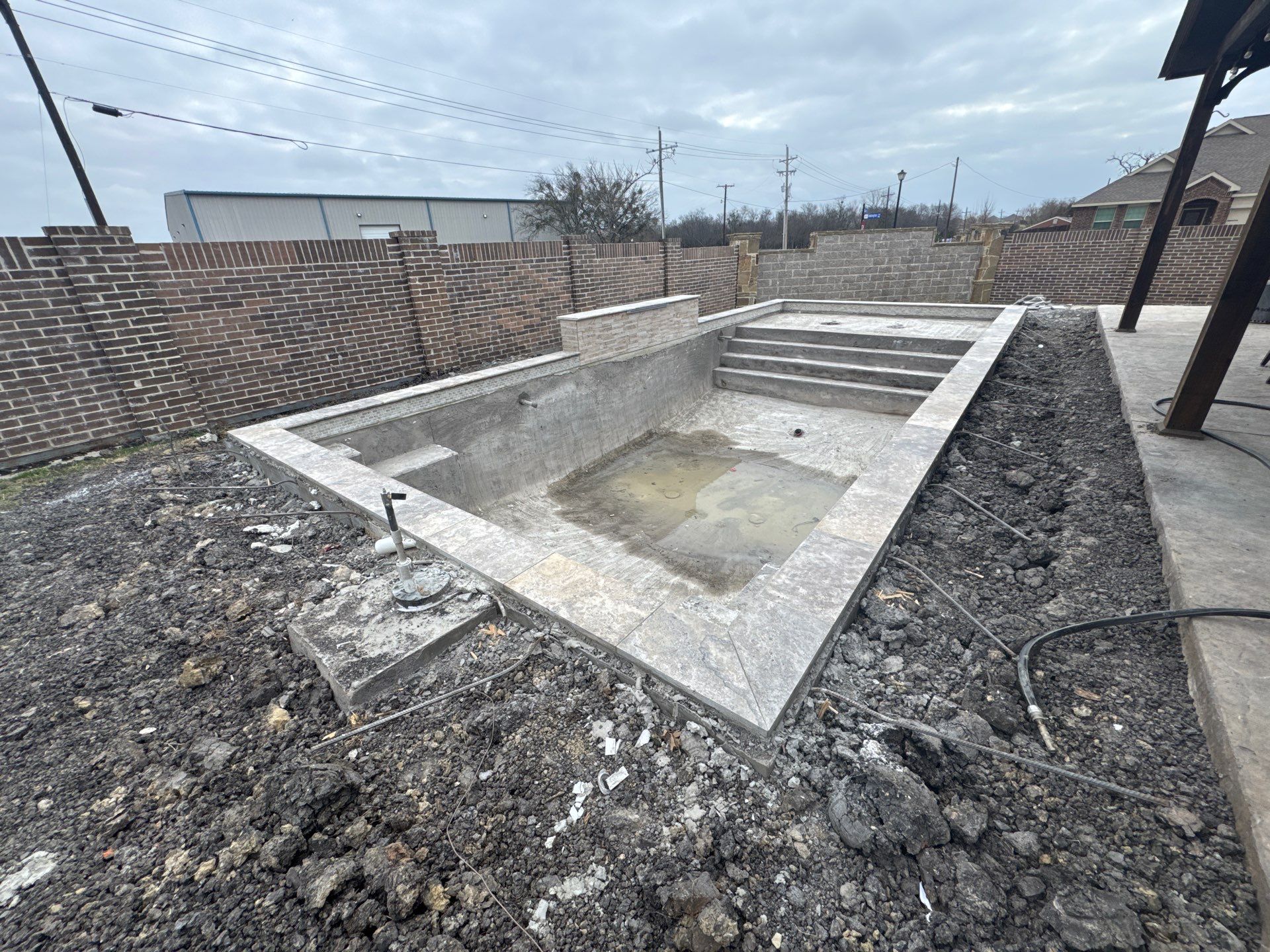 Geometric Pool with Tanning Ledge and Bubbler by Pinnacle Pools and Spas - DFW