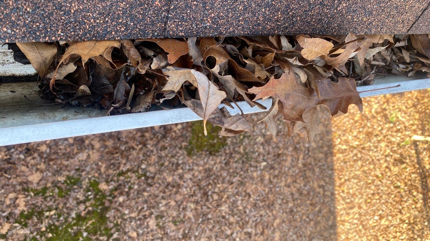 Cleaning Gutters  by Deerfield Roofing LLC