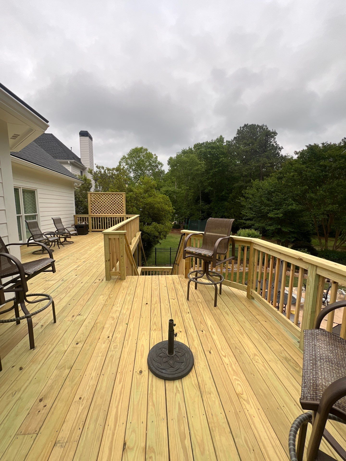 Multi-Level Pressure-Treated Wood Deck and Screened Porch in Acworth by Swift Home Renovations