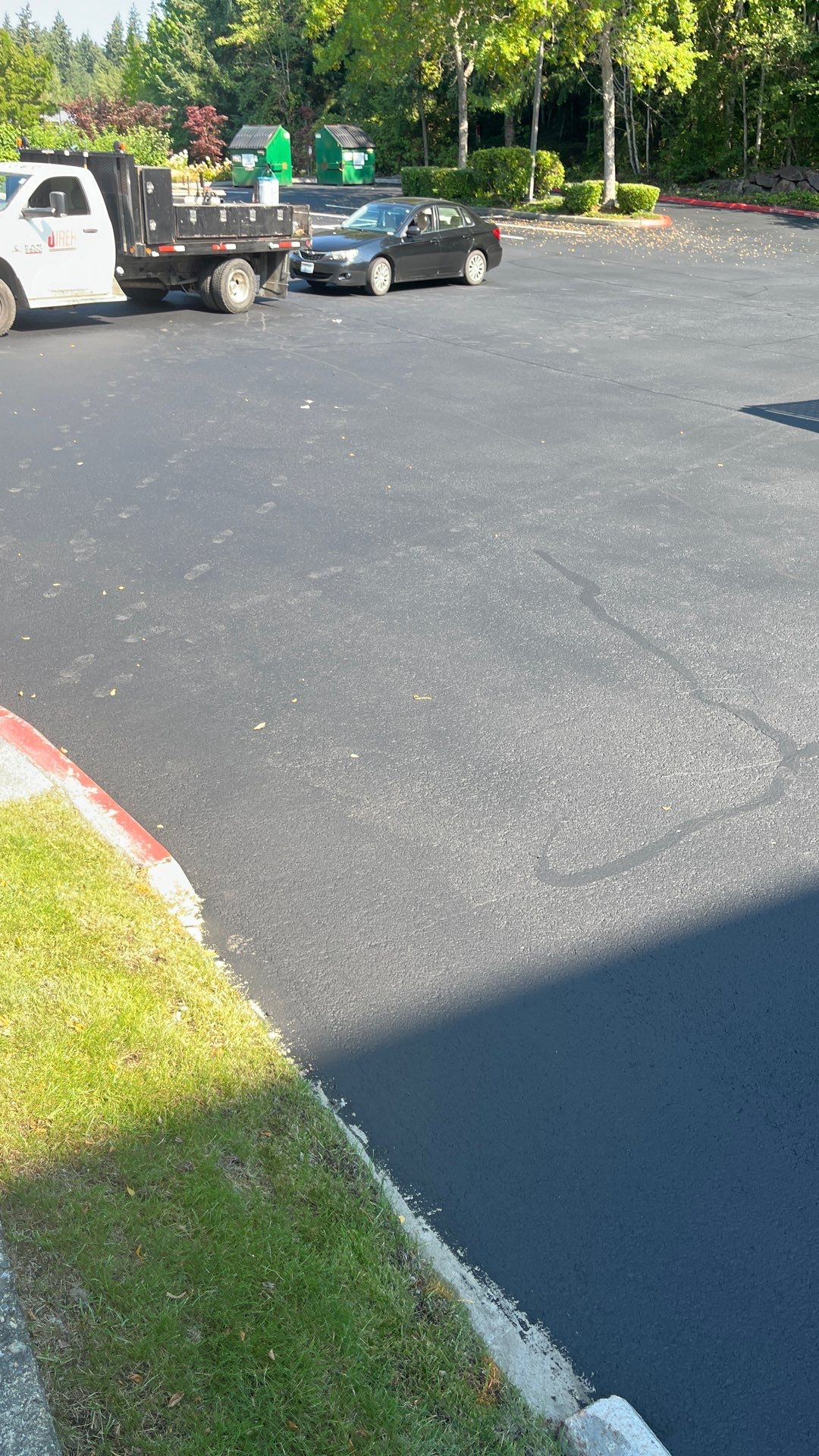 Kidder Matthews | Parking Lot Sealcoating & Striping with Concrete Curb & Patch Repairs  by Jireh Asphalt & Concrete Inc 
