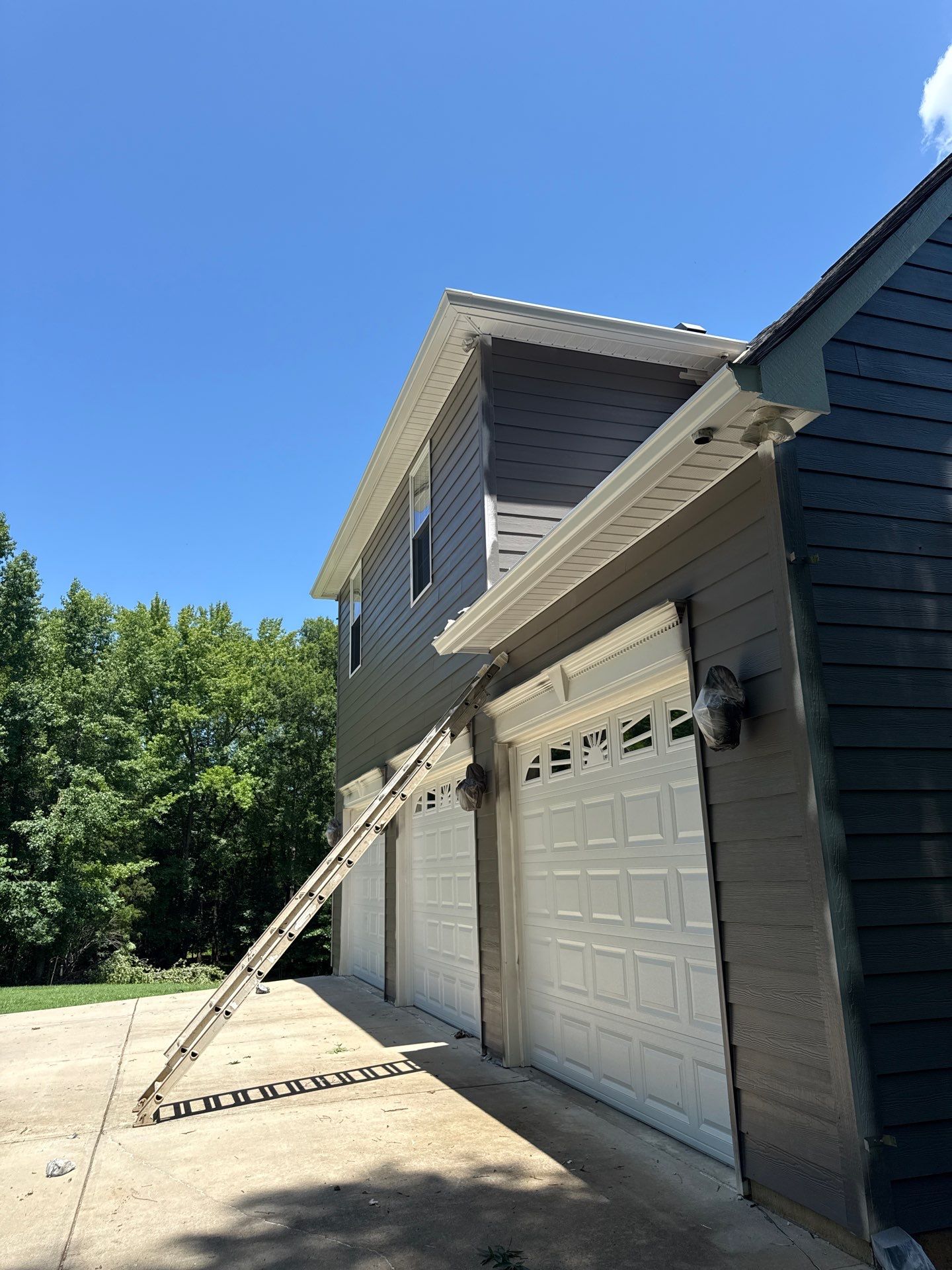 Siding replacement, exterior painting, and front door staining. by GonzalezPainters & Contractors Inc
