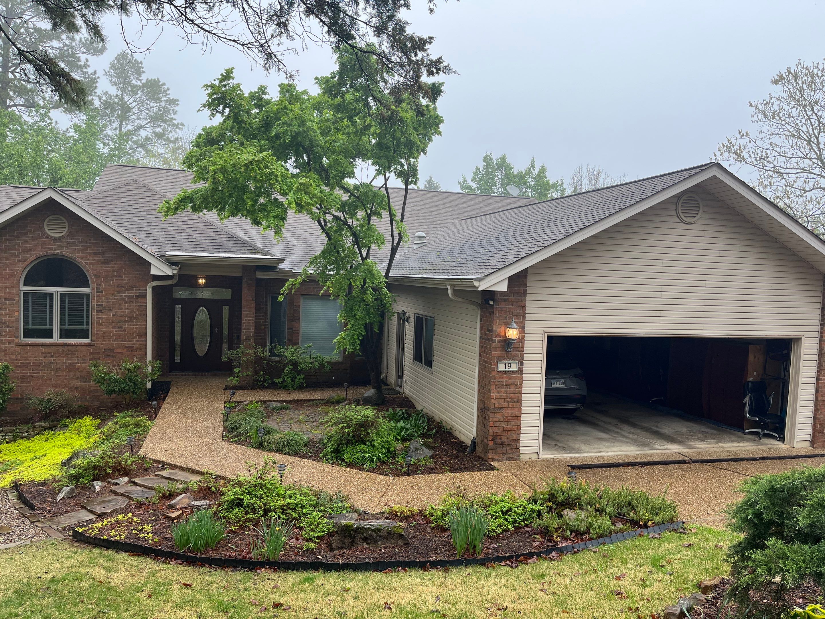 Architectural Shingle Roof Replacement and Skylight Installation in Hot Springs Village by Temple Roofing and Exteriors