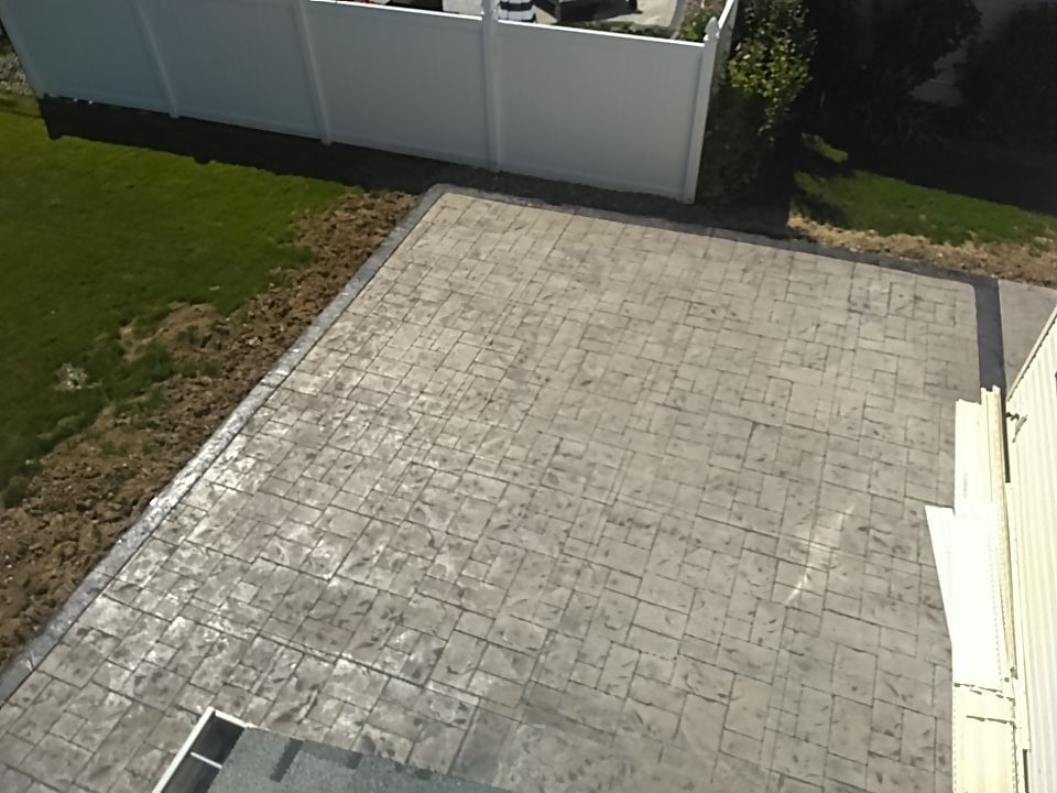 Stamped Concrete, Entry Door, and Concrete  by Ivy Lea Construction