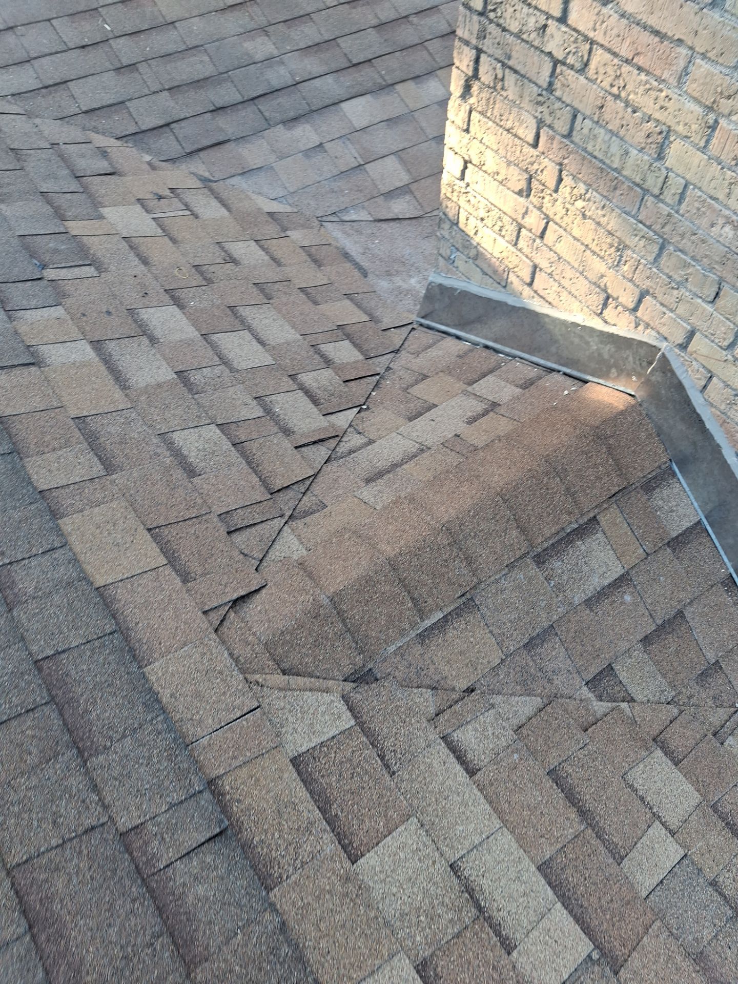 Chimneys need a Cricket.  by Bayfront Roofing and Construction