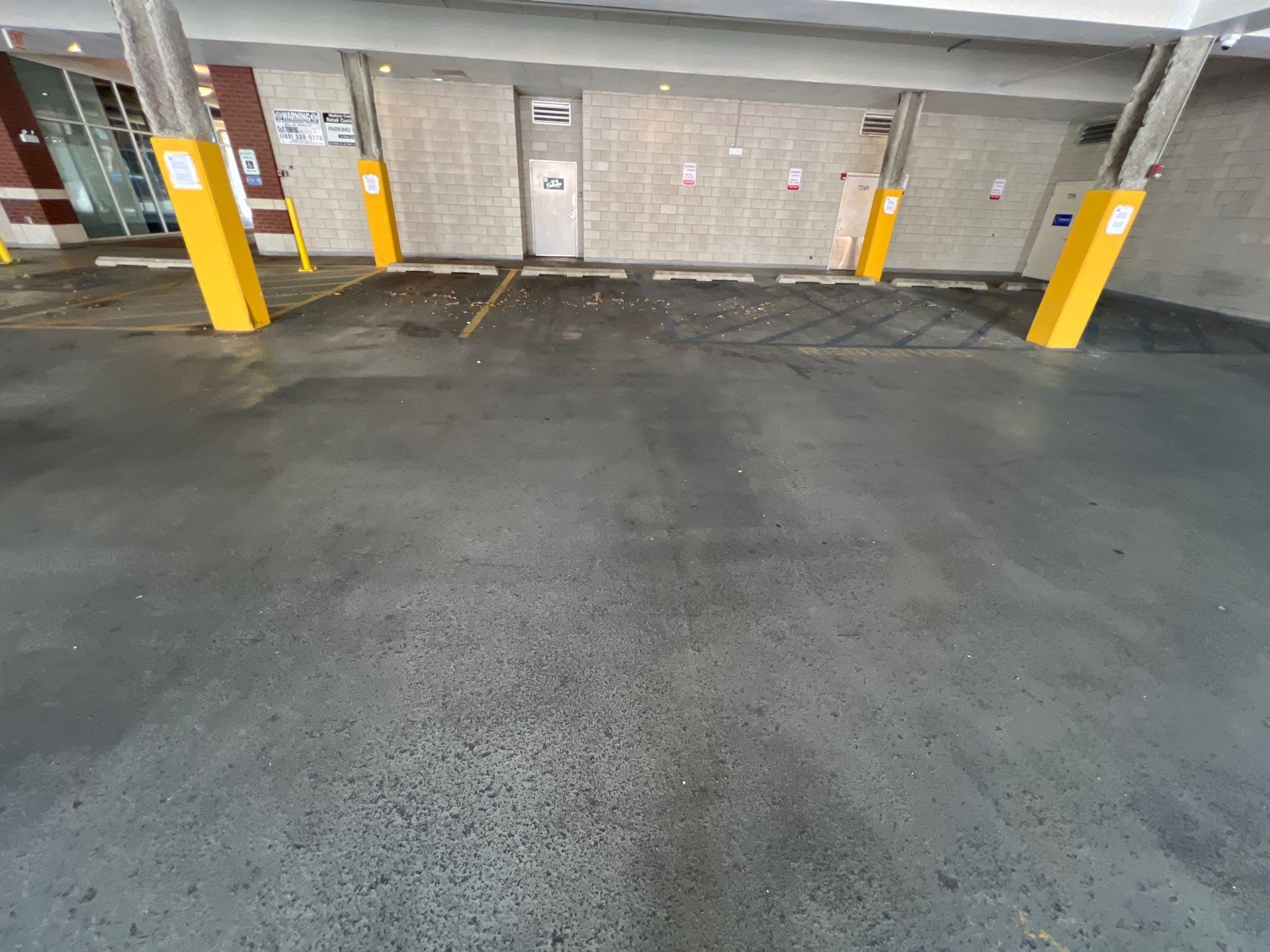 Parking garage using Hot water by Northern Power Washing LLC.