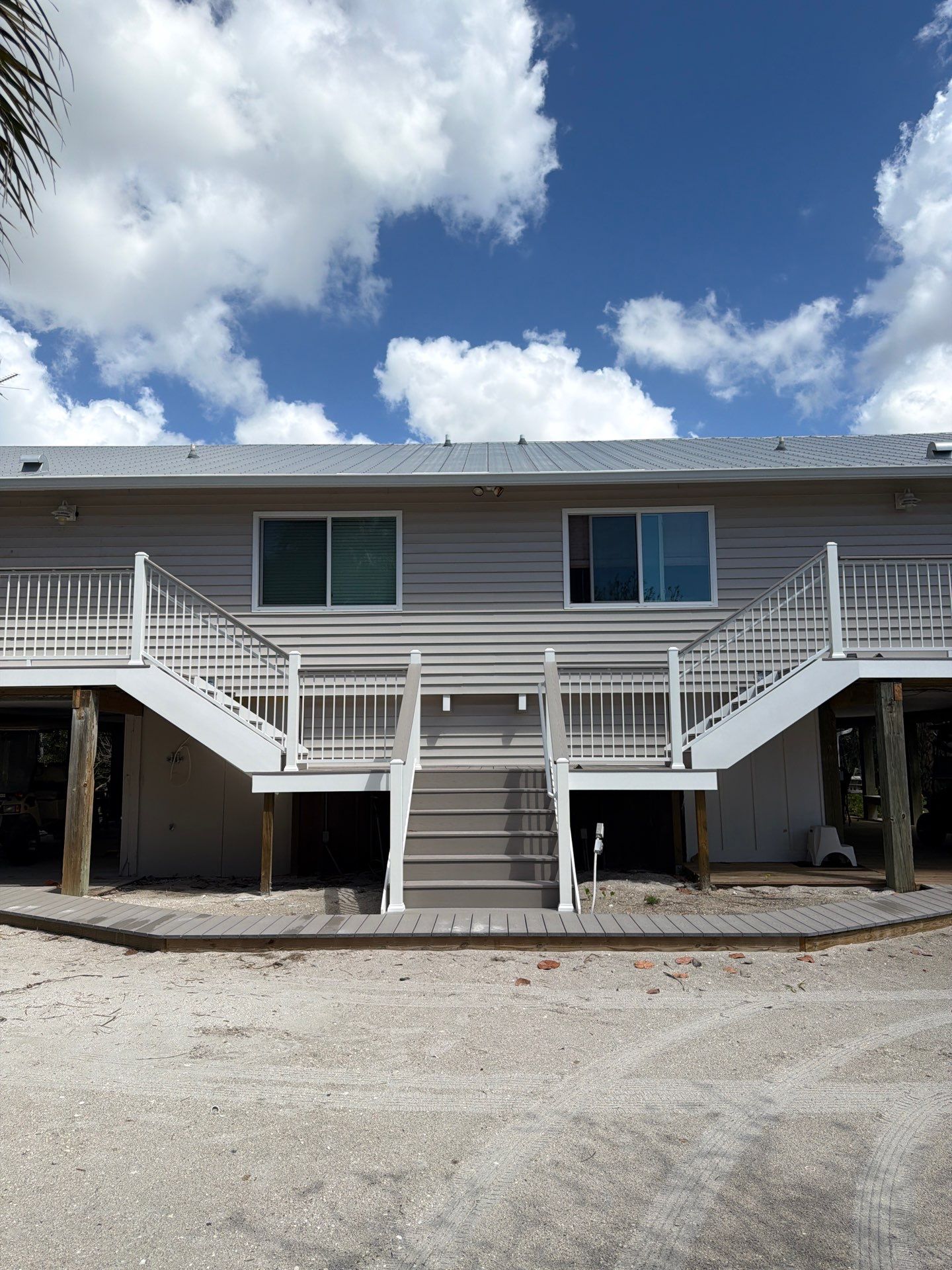 Elevated Composite Deck and Symmetrical Staircase Replacement in Englewood by Smirnov Construction Inc