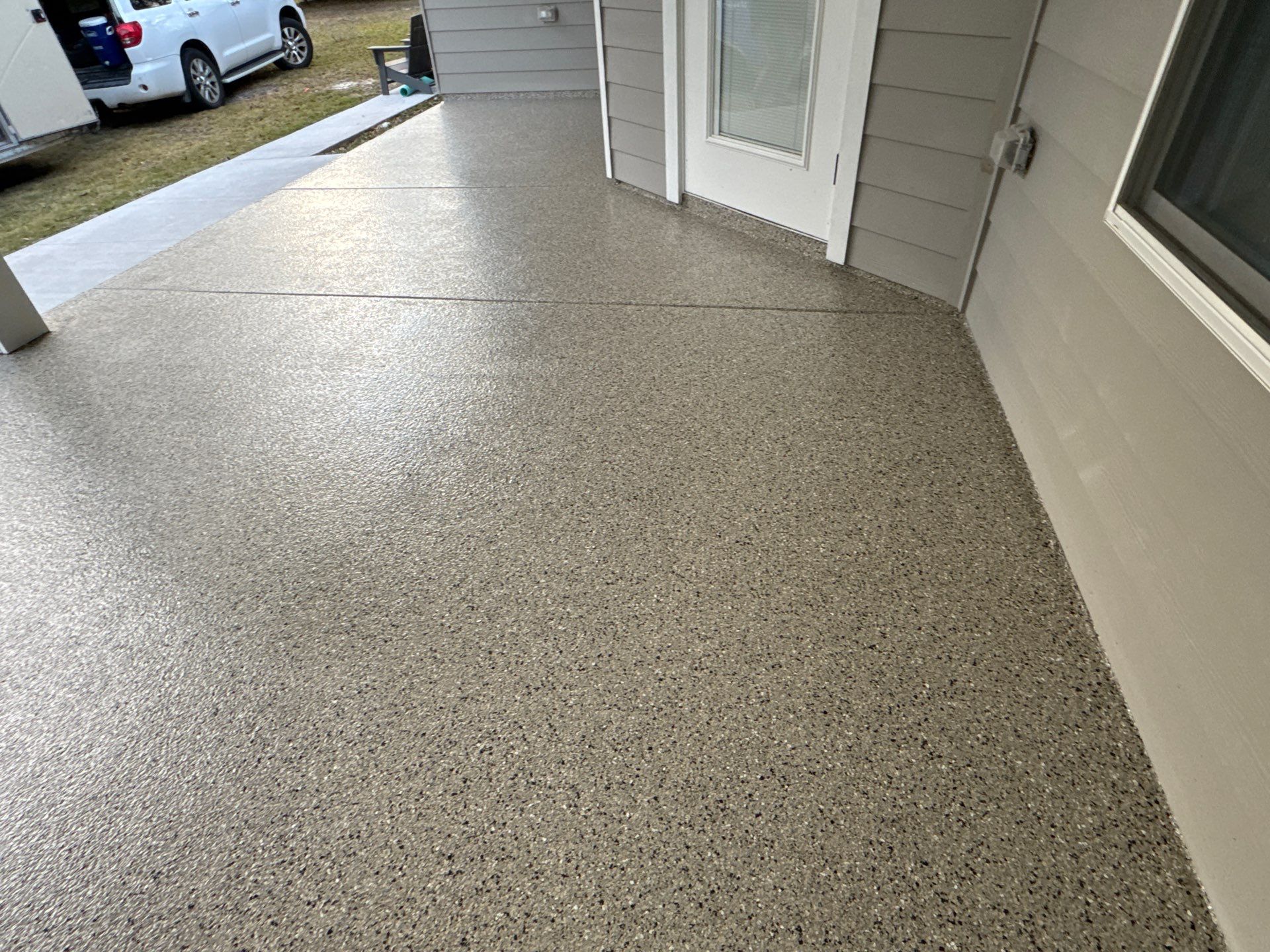 Patio and Sidewalk in Fort White, FL (Patio in Mediterranean, Sidewalk in Claystone Custom Hybrid) by Cross Creek Concrete Coatings