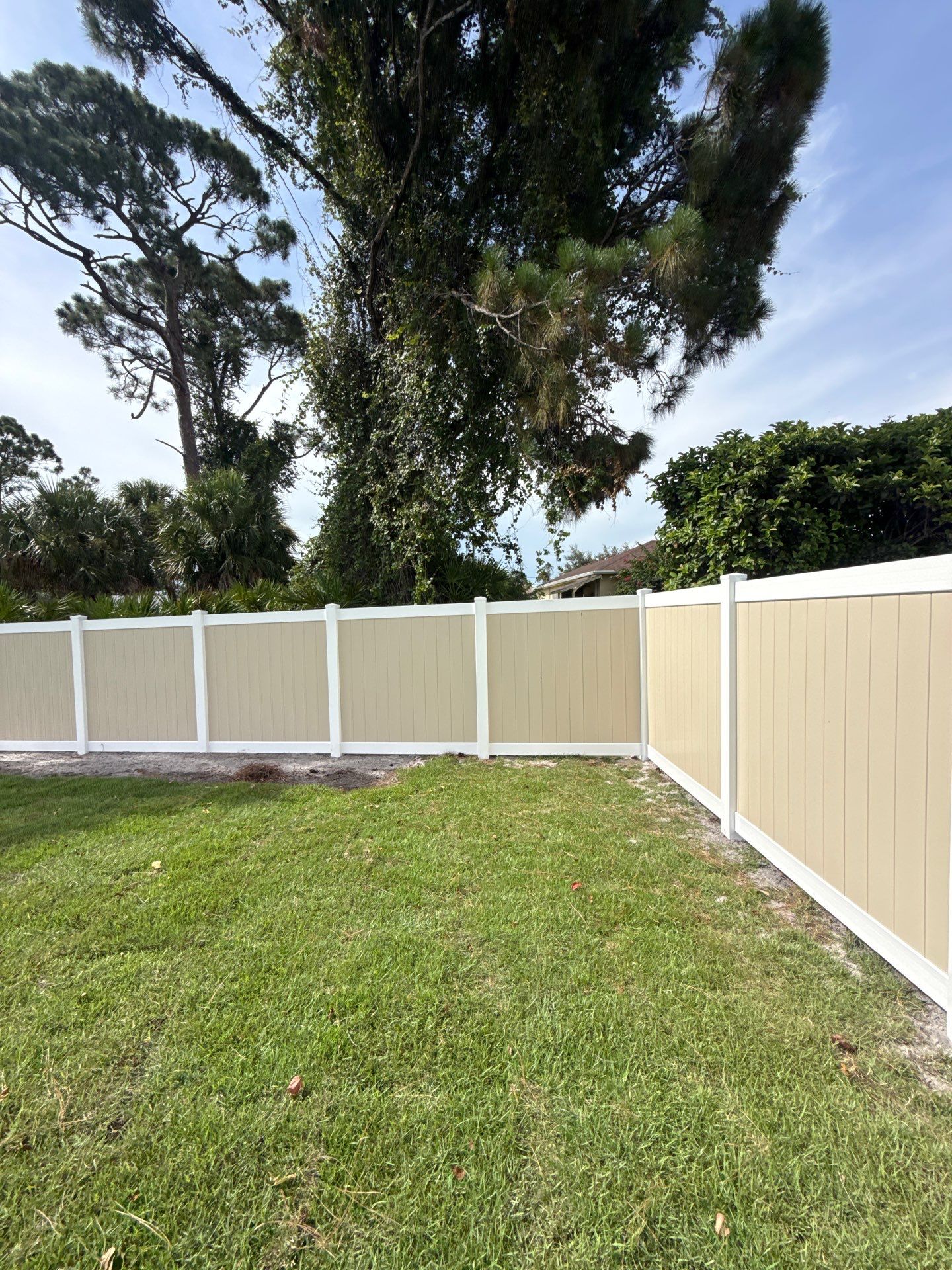 Custom Two-Tone Vinyl Privacy Fence Installation in North Port by True Fence LLC