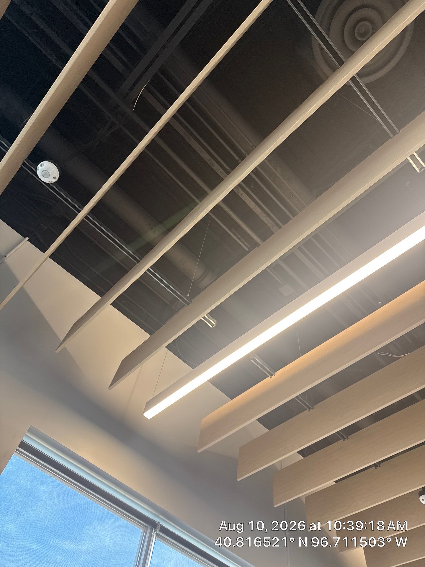 Commercial Office Remodel Featuring Acoustic Baffles and Integrated Lighting by CompanyCam Sales Demo