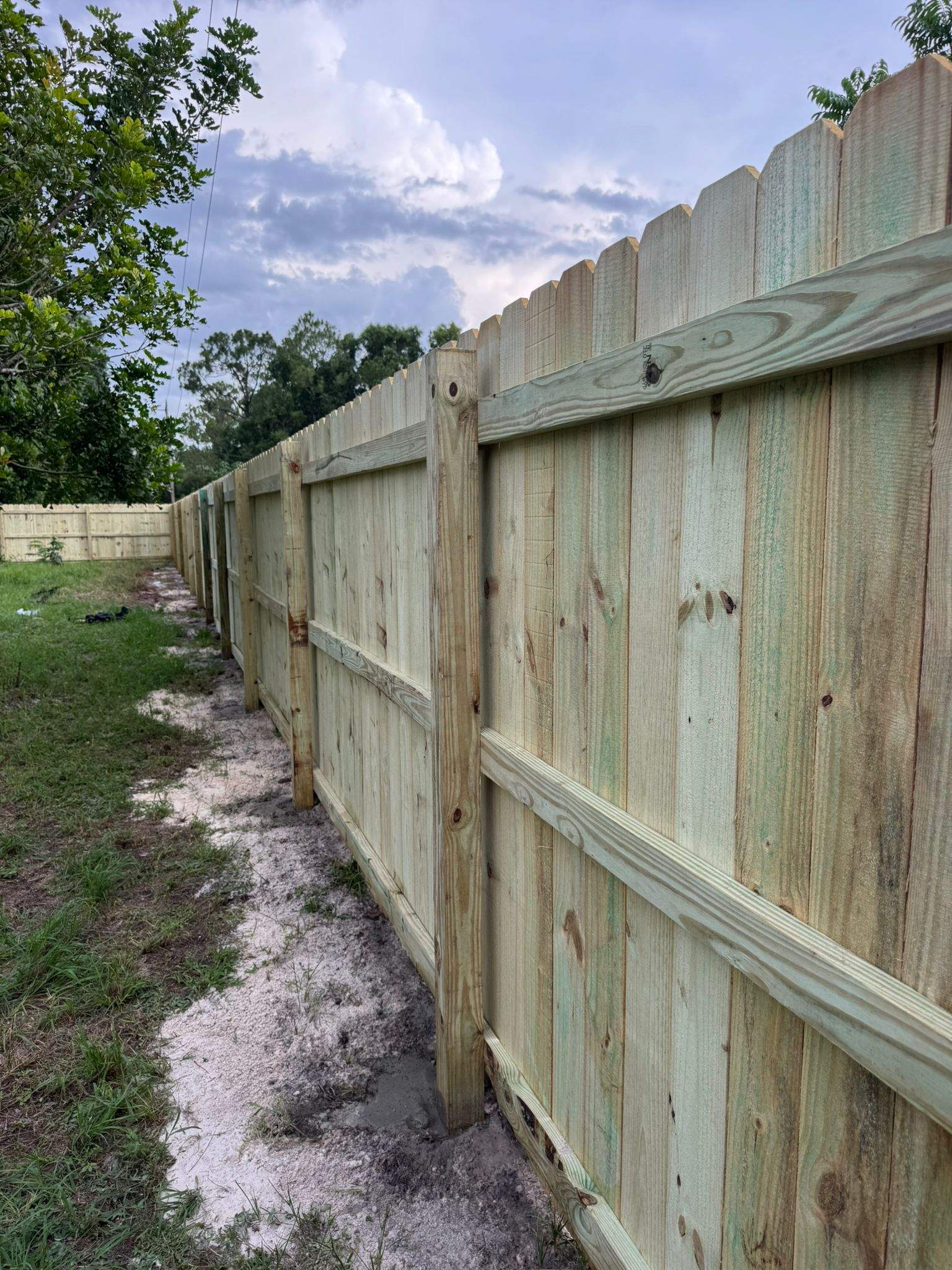 Pressure-Treated Wood Privacy Fence with Dog-Ear Pickets in Lehigh Acres by True Fence LLC
