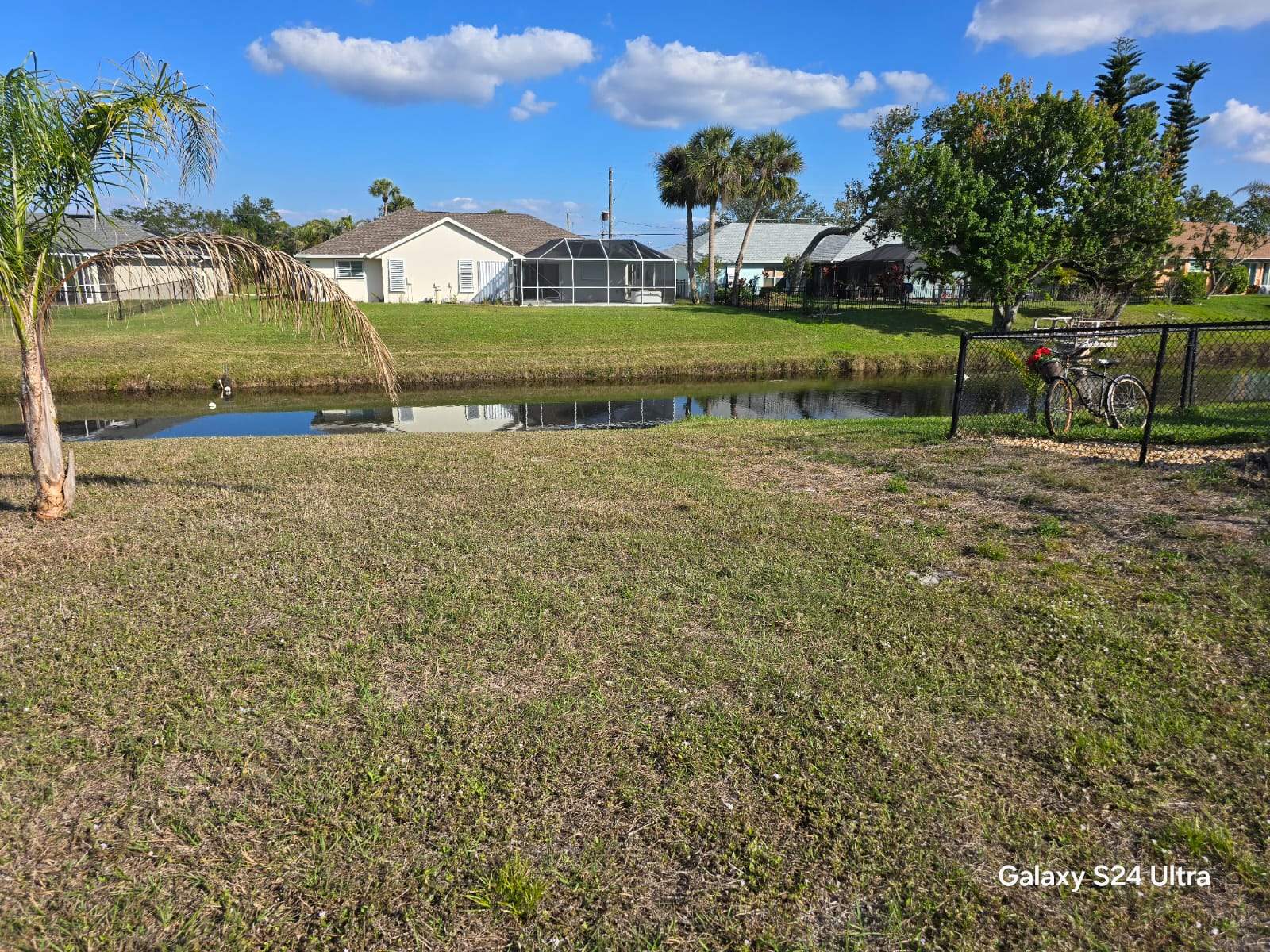 Waterfront Black Chain Link Fence Installation in Rotonda West by True Fence LLC