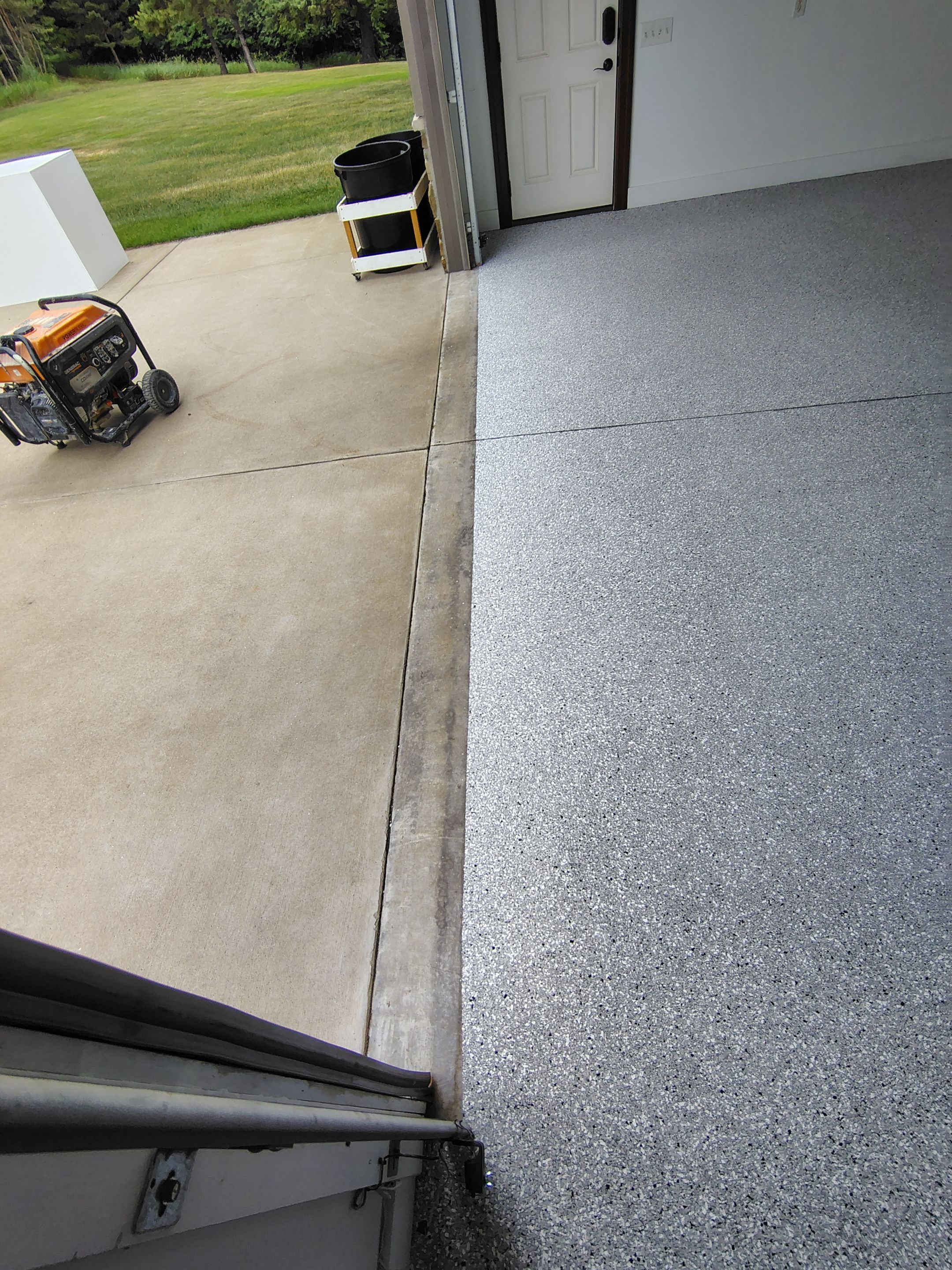 Feather Grey Floor Coating in Sioux Falls, SD by Select Painting, Coatings & Garage Cabinets