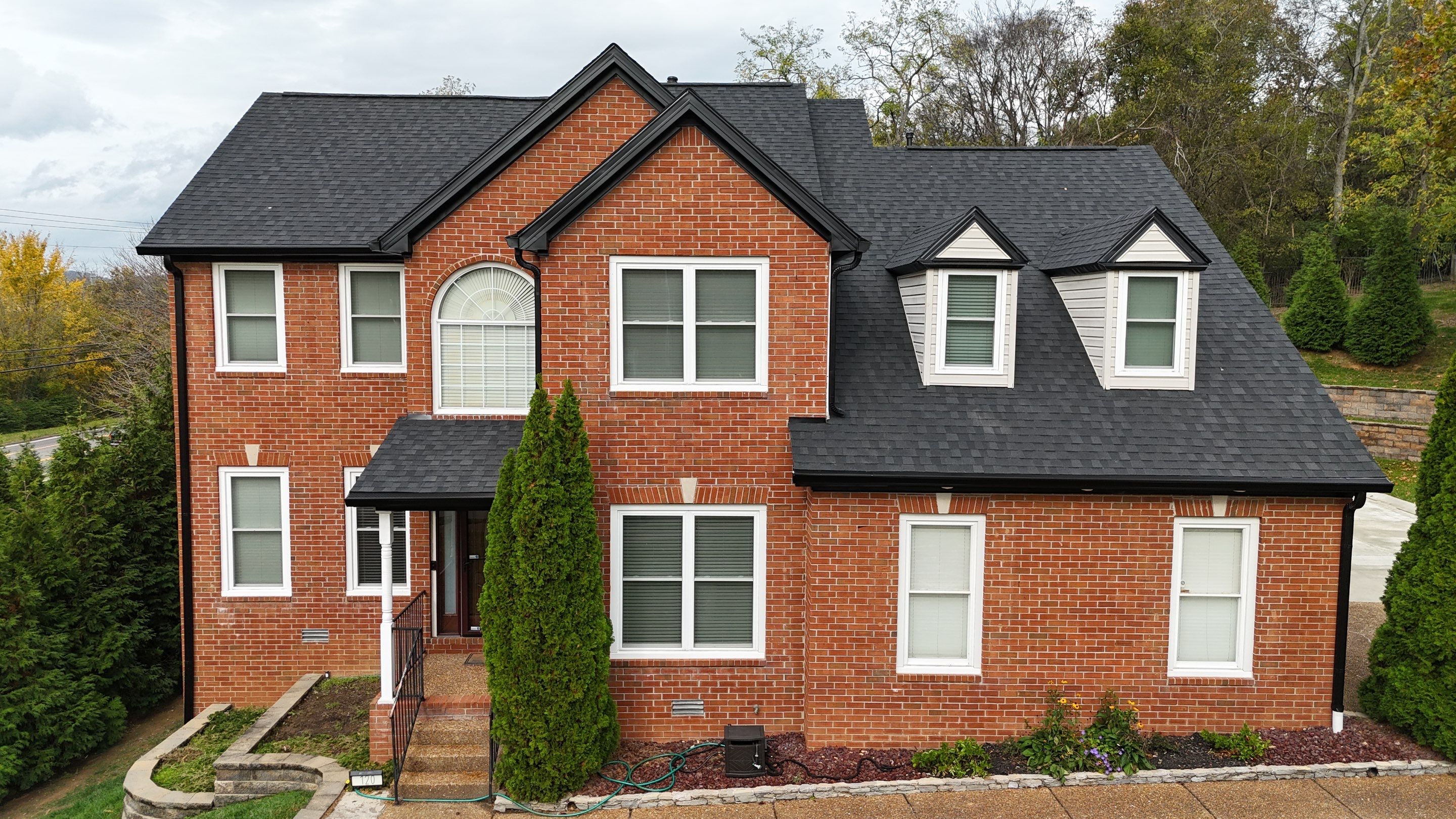 Charcoal Black Re-Roof & Gutters by Royal House LLC