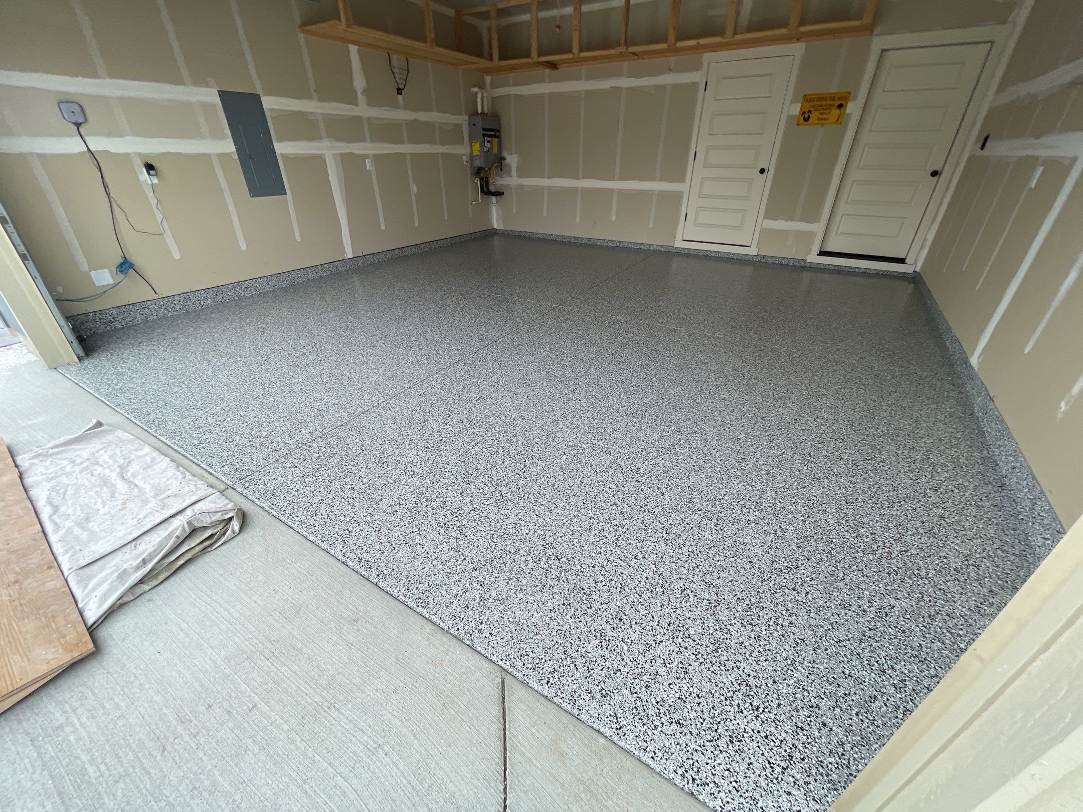 Garage Transformation using Domino by Croc Coatings, LLC