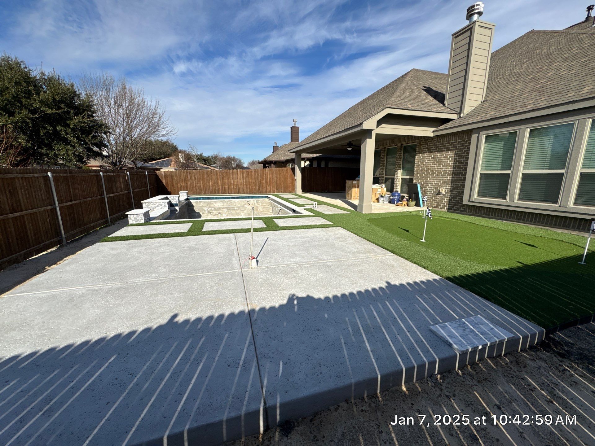 Geometric Pool with Raised Water Feature Wall and Turf by Pinnacle Pools and Spas - DFW
