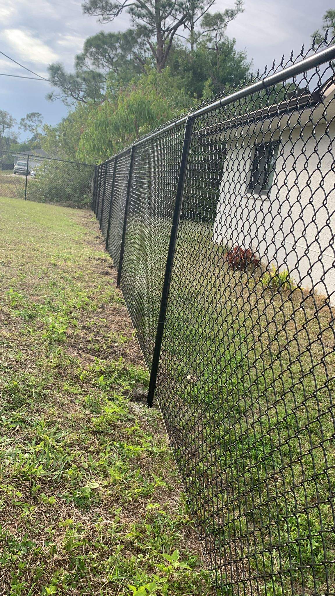 Black Vinyl-Coated Chain-Link Fence Installation in Port Charlotte by True Fence LLC