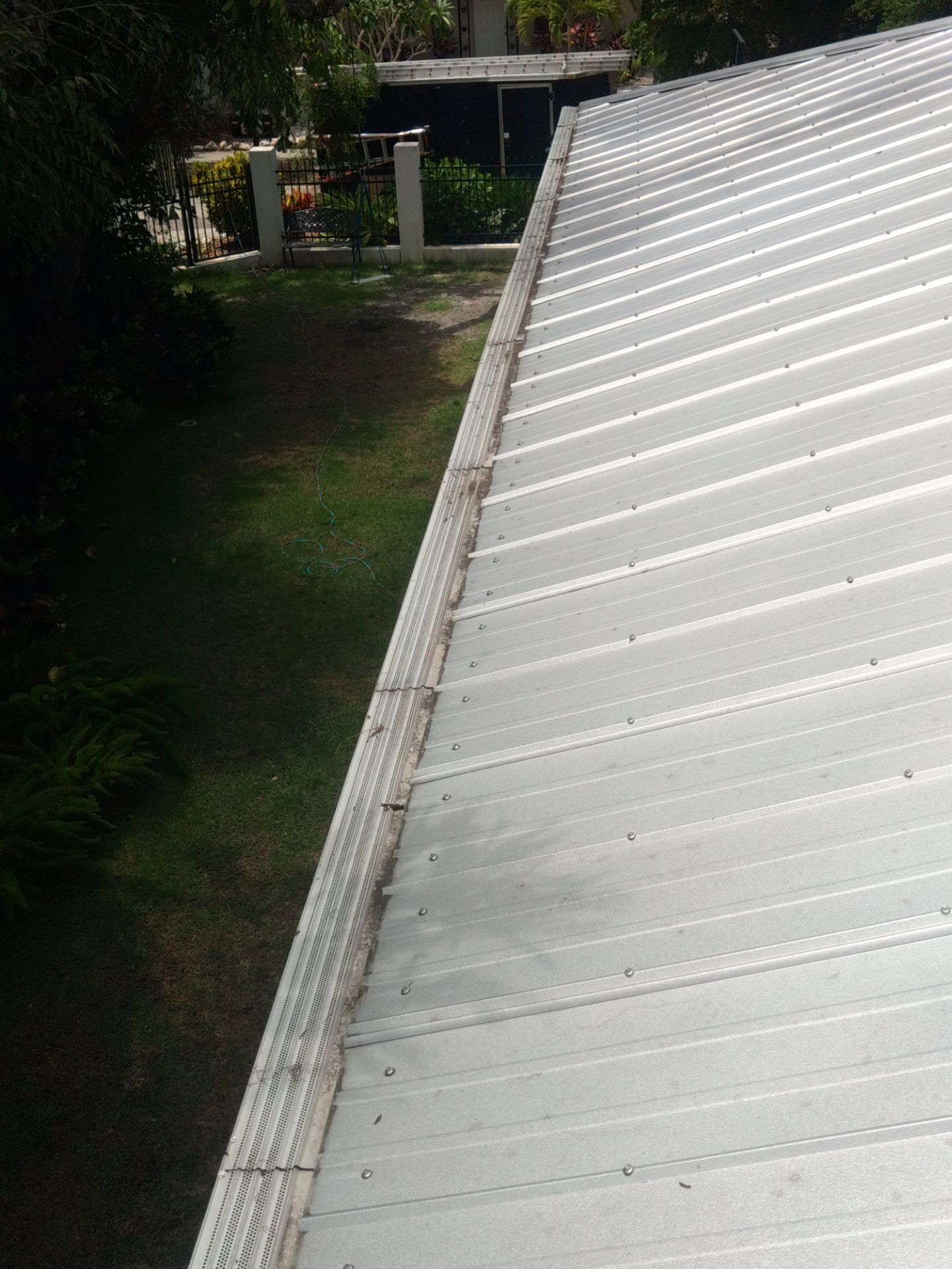 Gutter guards installation combined with gutter cleaning in Sarasota, FL by Gutter Professors