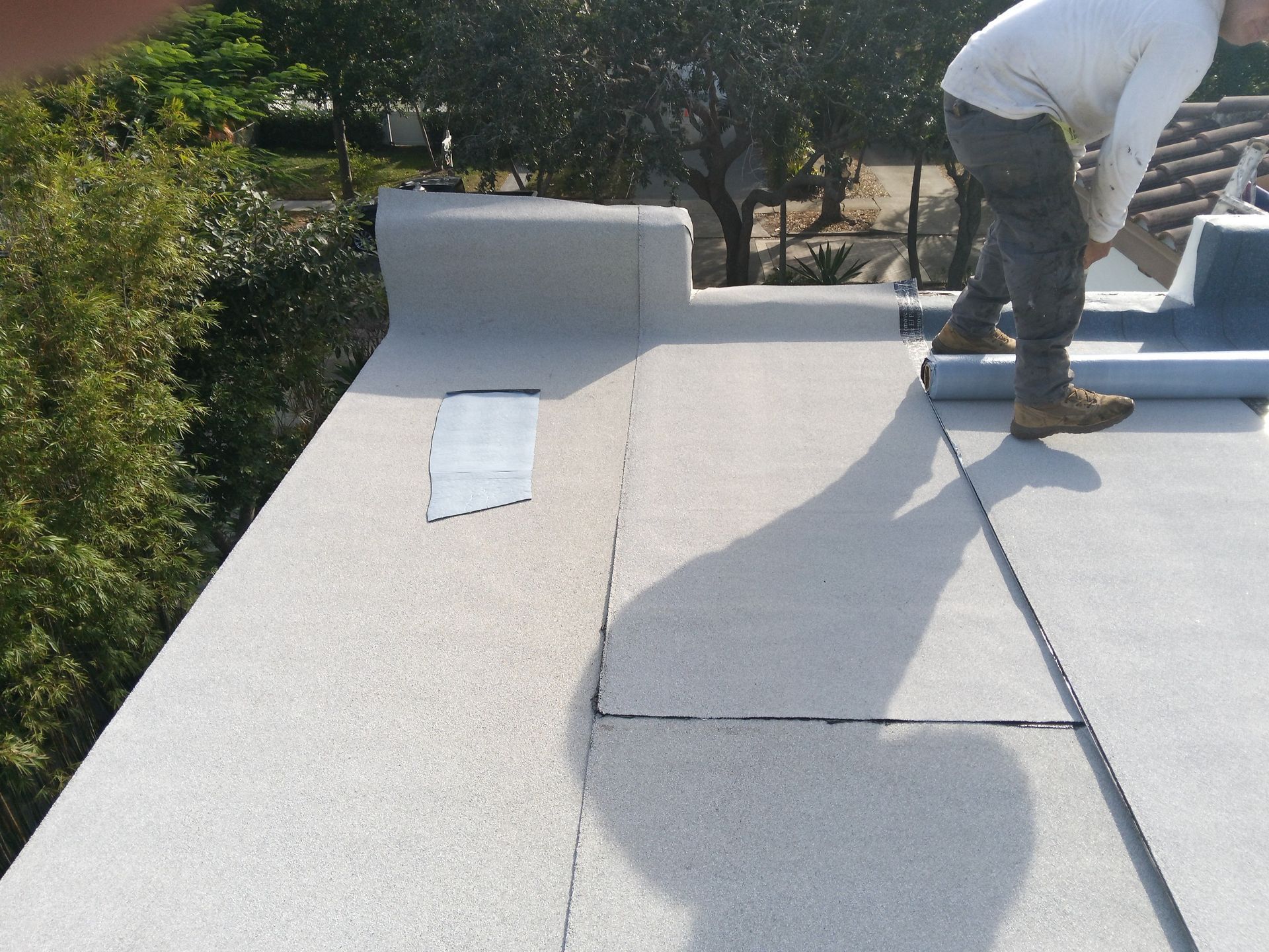 West Palm Beach Roof Restoration and Travertine Paver Driveway Installation by Aastro Roofing