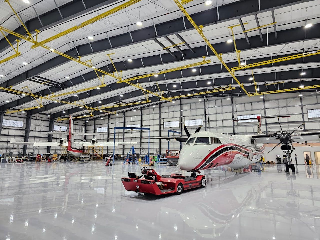 Airplane Hanger using Light Grey Commercial Penntek Epoxy by Croc Coatings, LLC