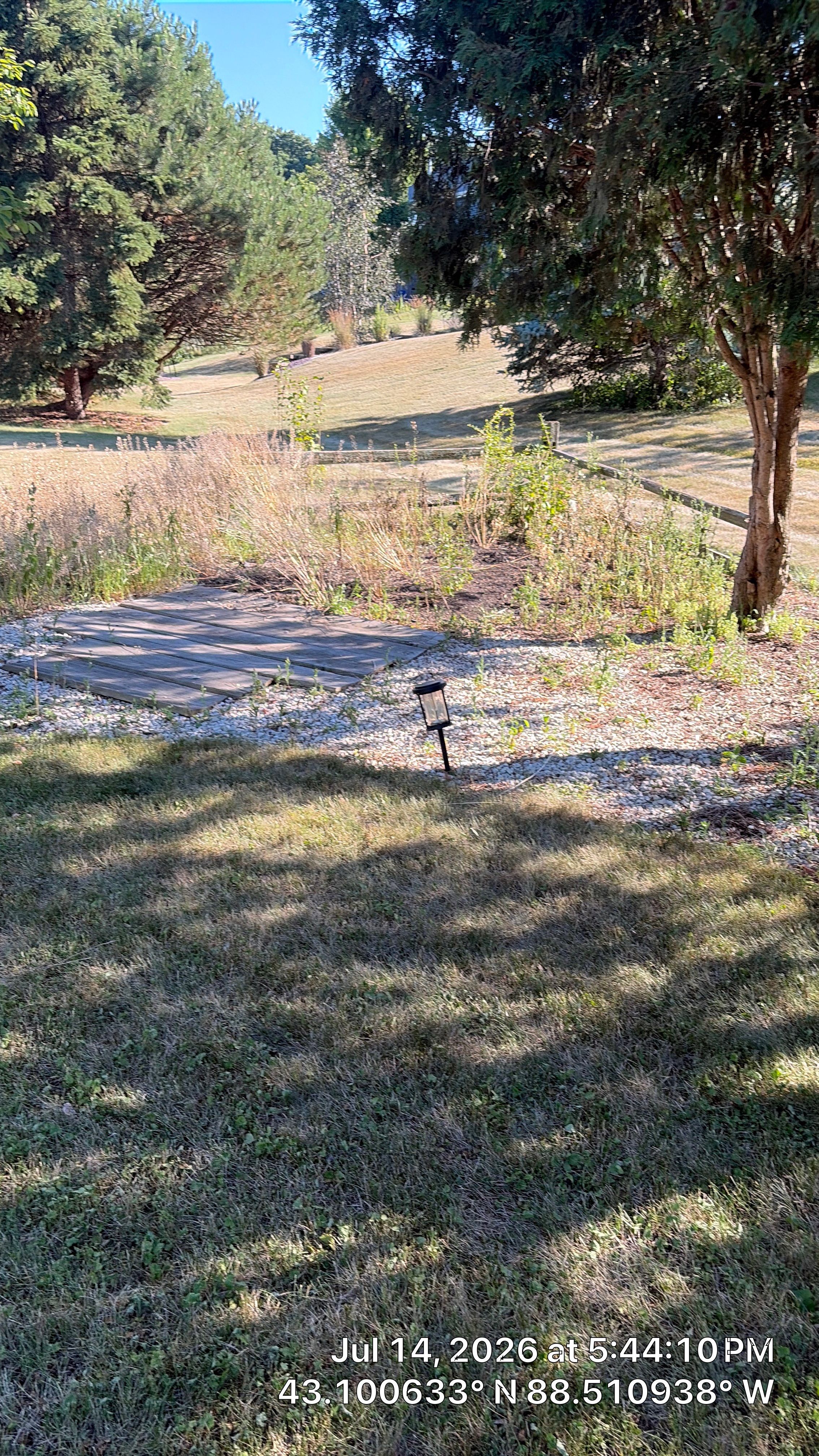 Decorative Stone and River Rock Landscaping for Oconomowoc Residence by CompanyCam Sales Demo
