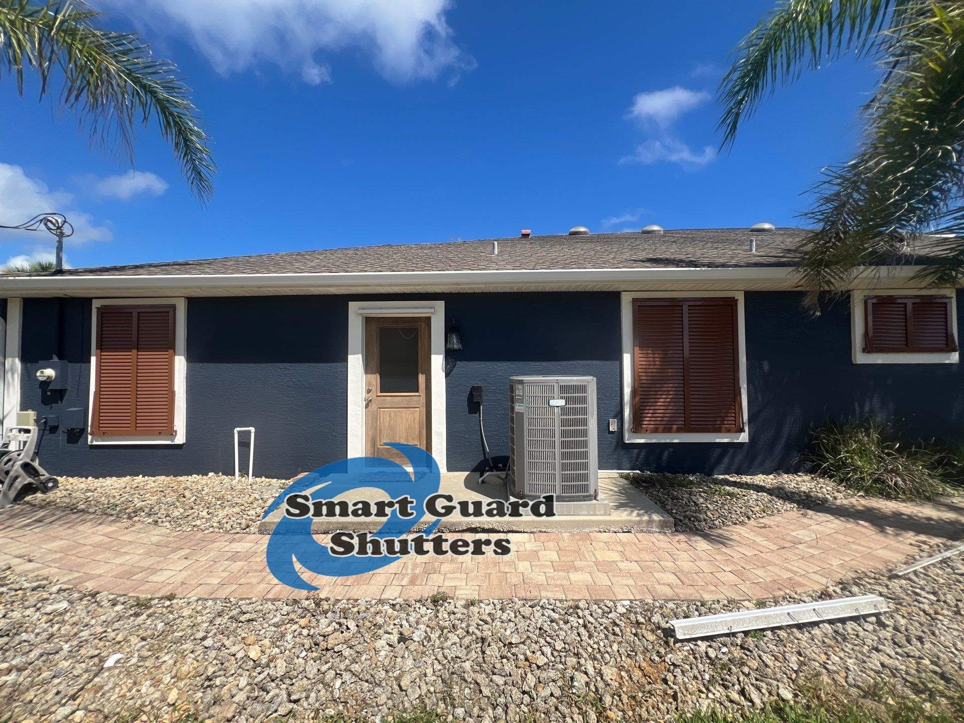 Impact Rated Bahama Shutters in Beige Brown by Smart Guard Shutters