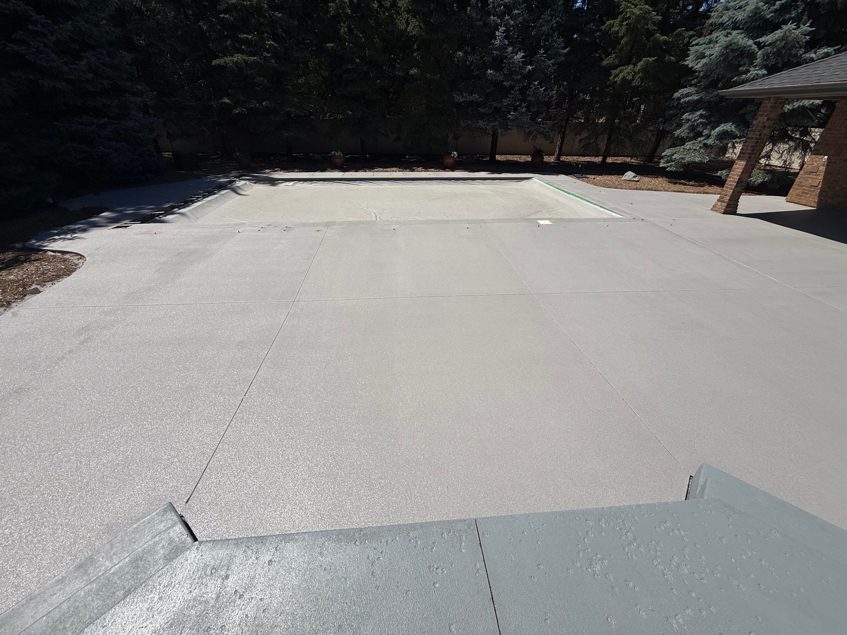Decorative Concrete Pool Deck and Patio Resurfacing in Sioux Falls by Select Painting, Coatings & Garage Cabinets