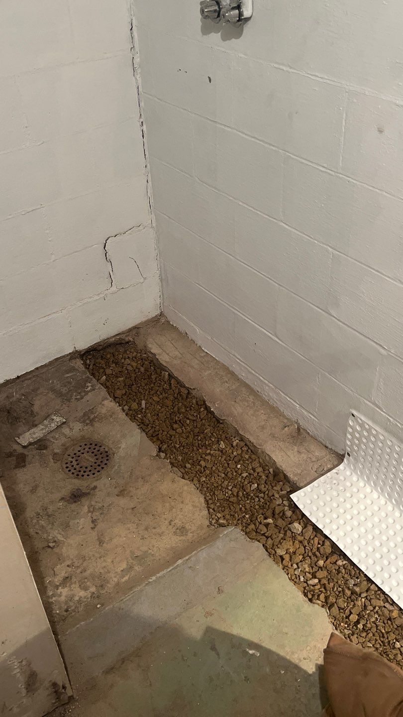 Interior drain tile system installation by ACE Waterproofing & Basement Solutions