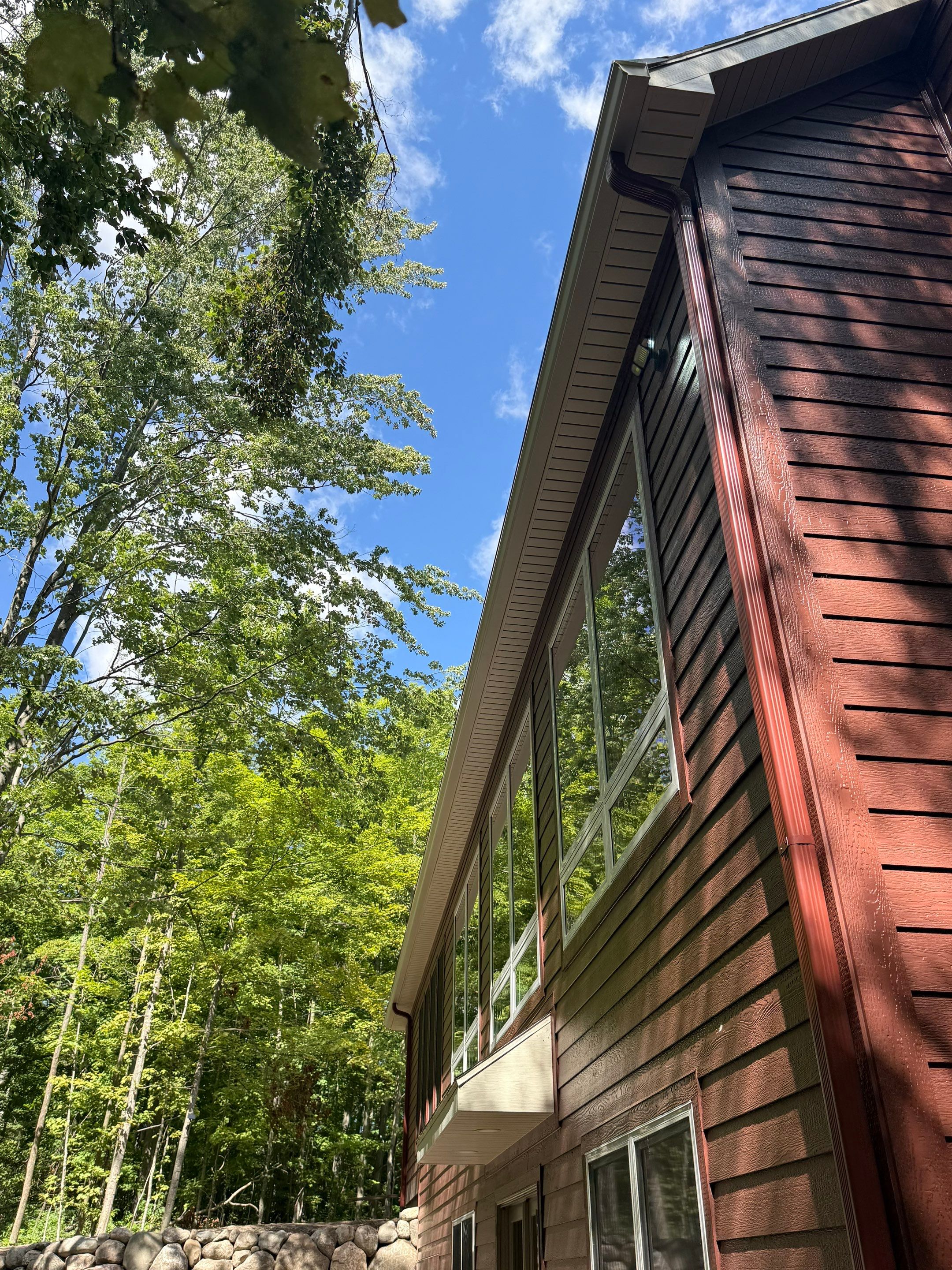 Gutter and Gutter Helmet Installation for Charlevoix Residential Project by Rainbow Seamless Systems