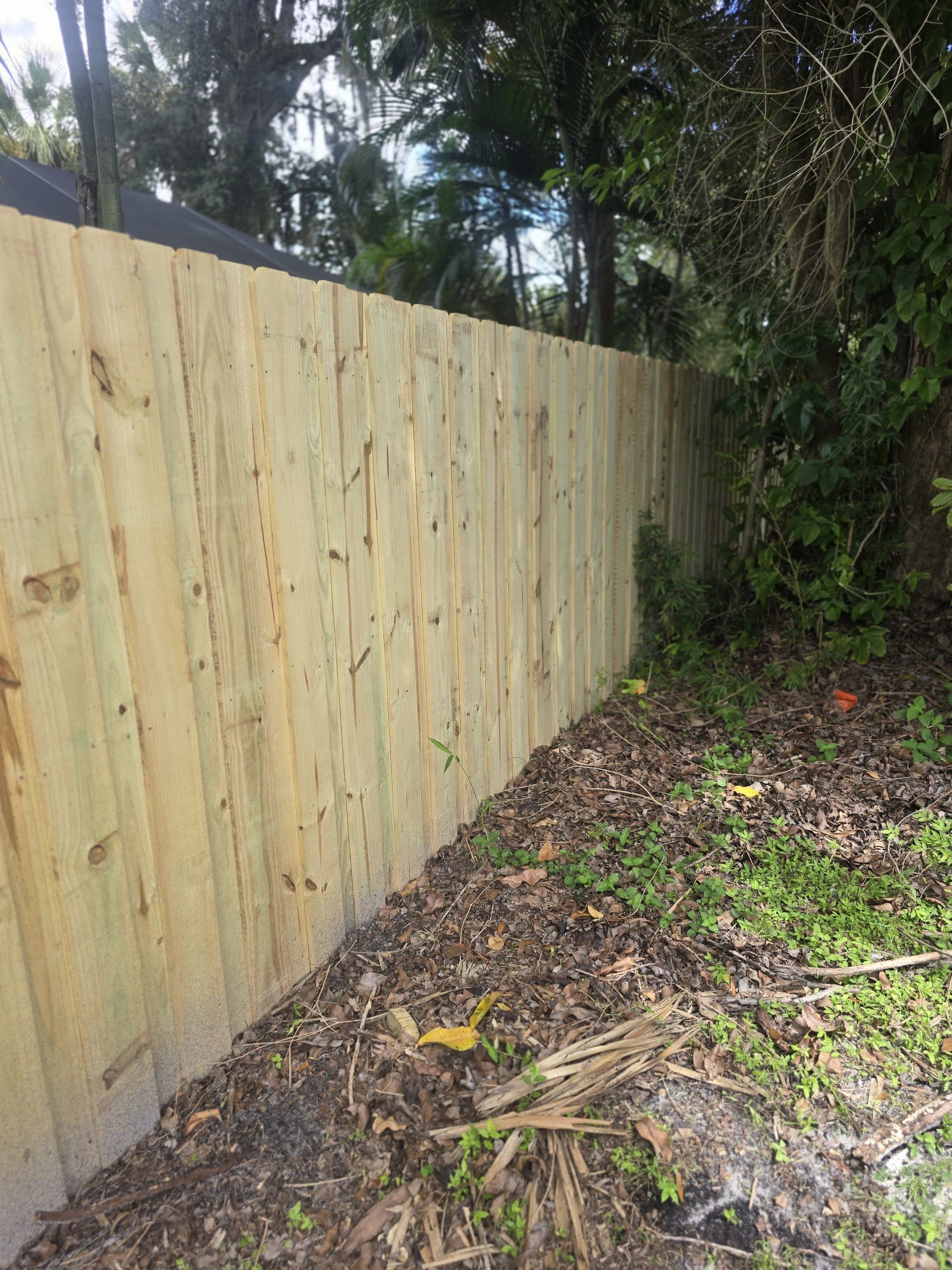 Wood Privacy Fence Installation with Double Gate in Port Charlotte by True Fence LLC